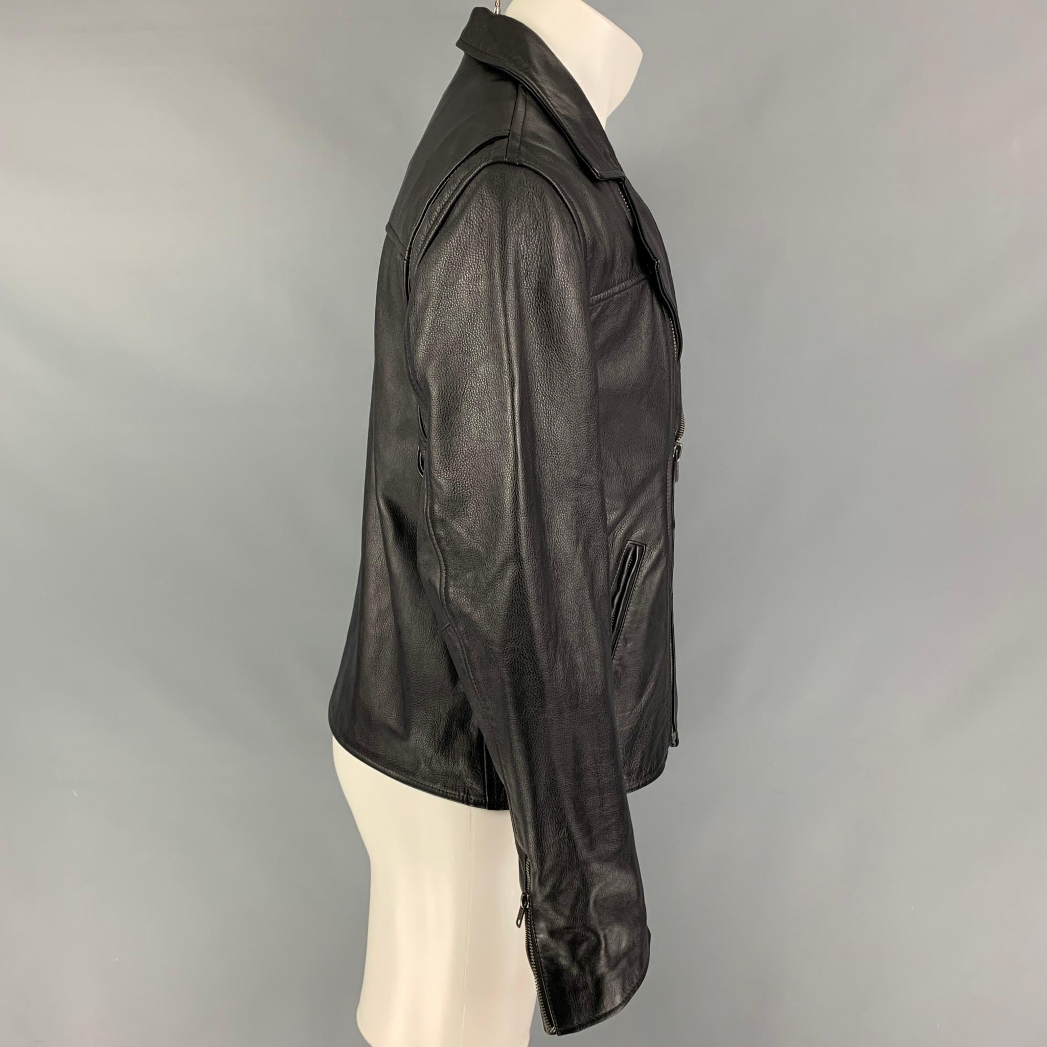 LEVI'S MADE & CRAFTED jacket comes in a black leather featuring a biker style, slit pockets, zipped cuffs, and a zip up closure. Made in Italy. 

New Without Tags. 
Marked: 1

Measurements:

Shoulder: 18.5 in.
Chest: 40 in.
Sleeve: 25 in.
Length:
