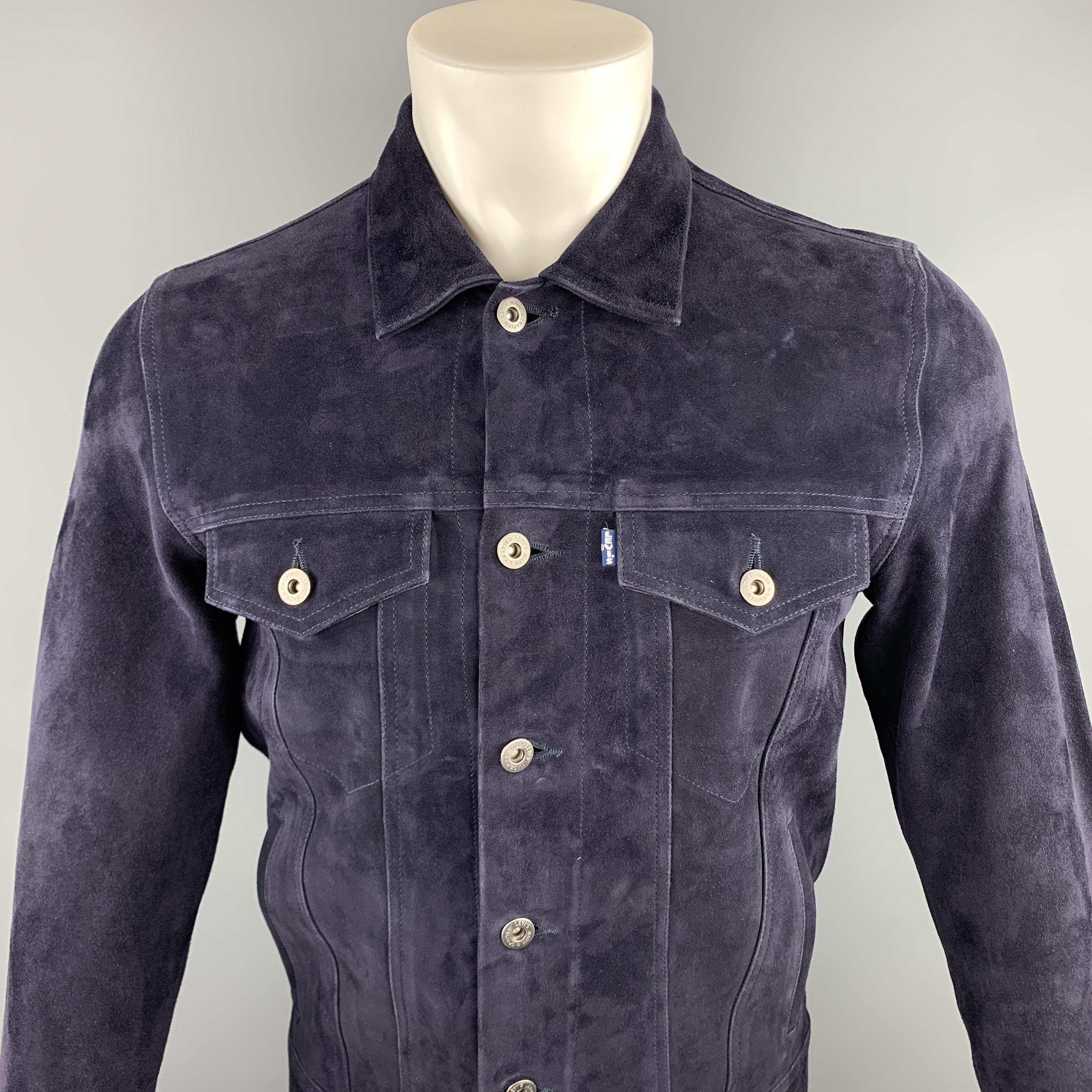 LEVI'S MADE & CRAFTED jacket comes in a navy suede featuring a trucker style, contrast stitching, and a buttoned closure.

New With Tags. 
Marked: S

Measurements:

Shoulder: 15 in. 
Chest: 38 in.
Sleeve: 26 in. 
Length: 24.5 in. 