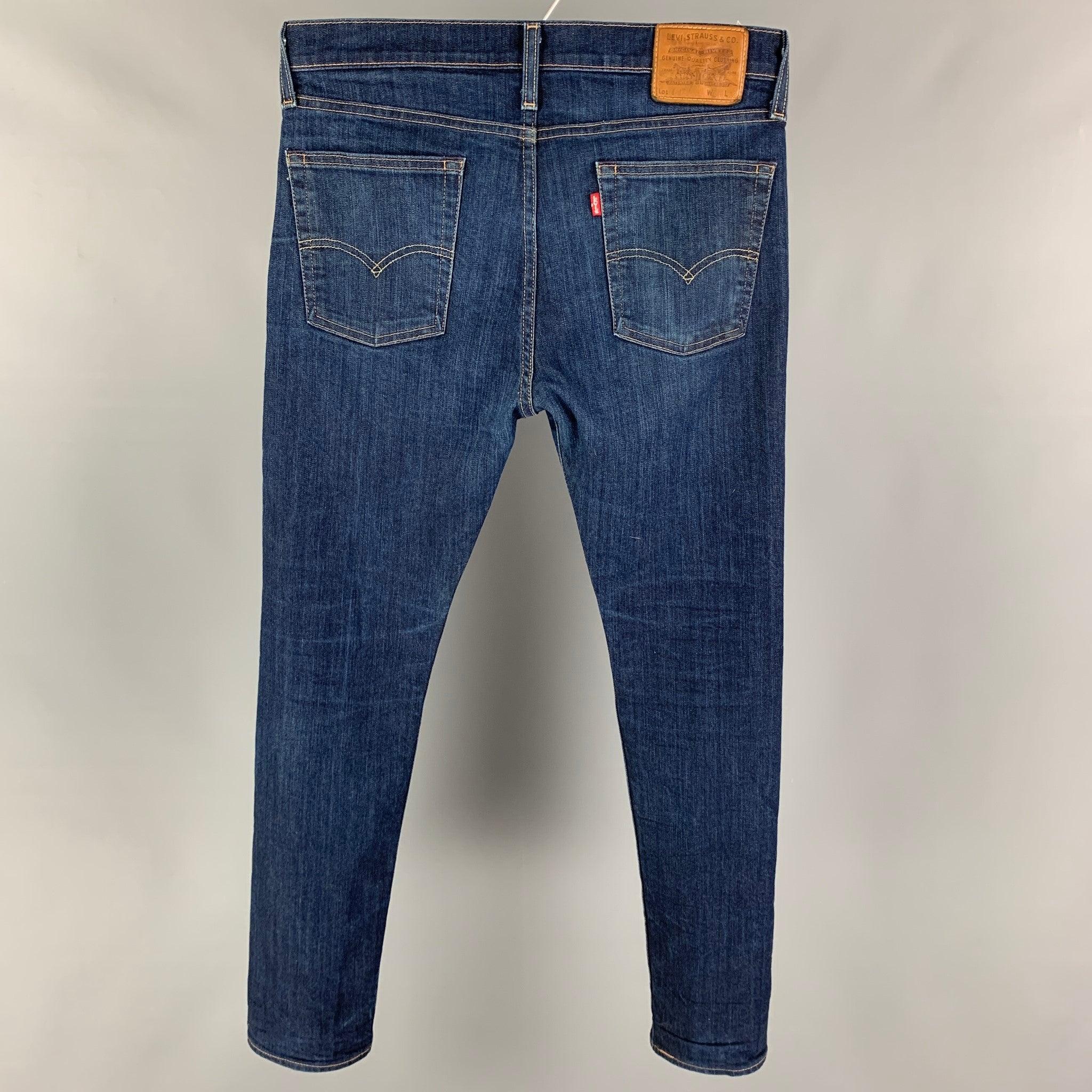 LEVI'S jeans comes in a blue washed cotton featuring a slim fit, contrast stitching, and a zip fly closure.
Very Good
Pre-Owned Condition. 

Marked:   33/32 

Measurements: 
  Waist: 34 inches Rise: 10 inches Inseam: 30 inches Leg Opening: 12 inches