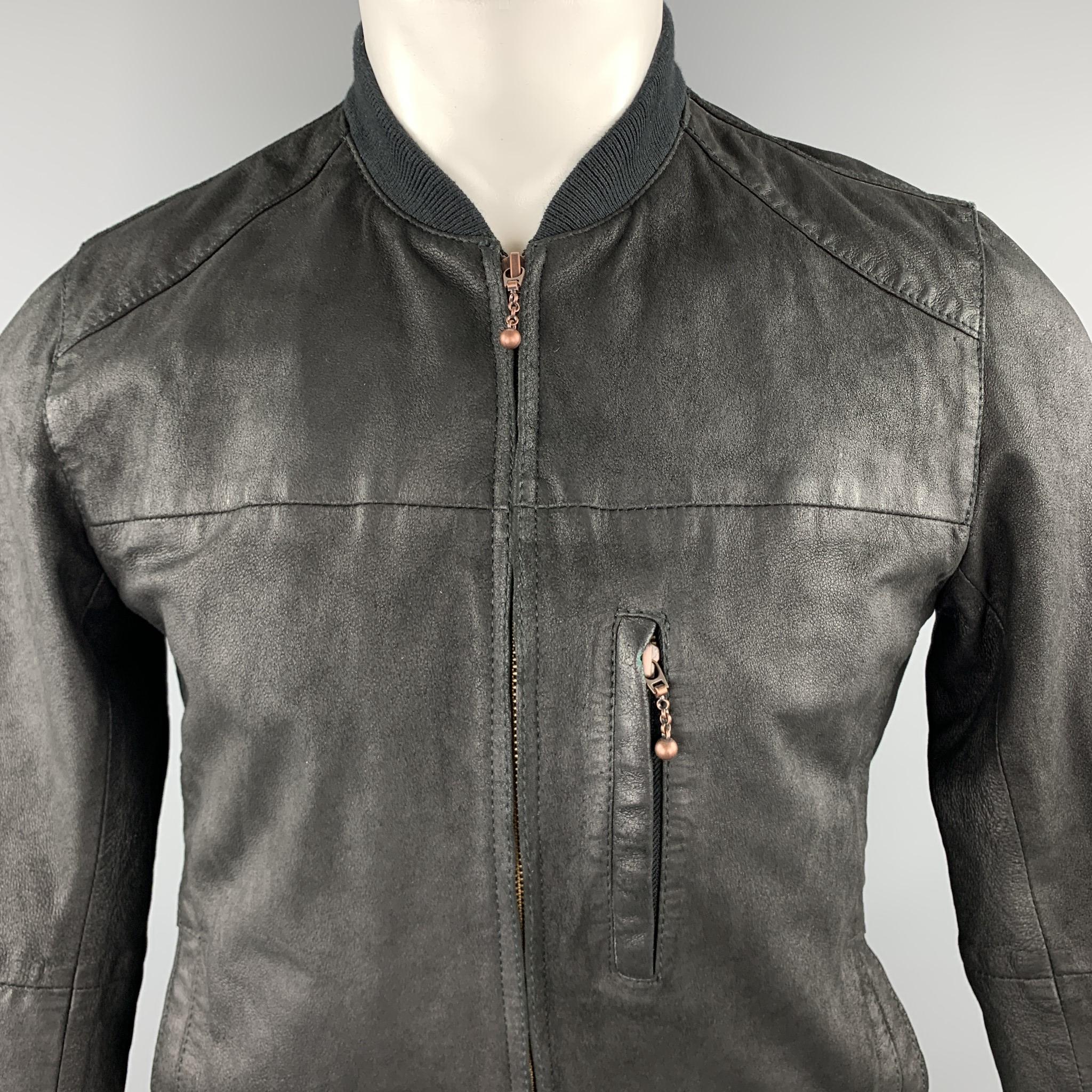 LEVI'S bomber jacket comes in a distressed leather with a baseball collar, zip front, and zip pocket. 

Excellent Pre-Owned Condition.
Marked: S

Measurements:

Shoulder: 16 in.
Chest: 40 in.
Sleeve: 24.5 in.
Length: 26 in.