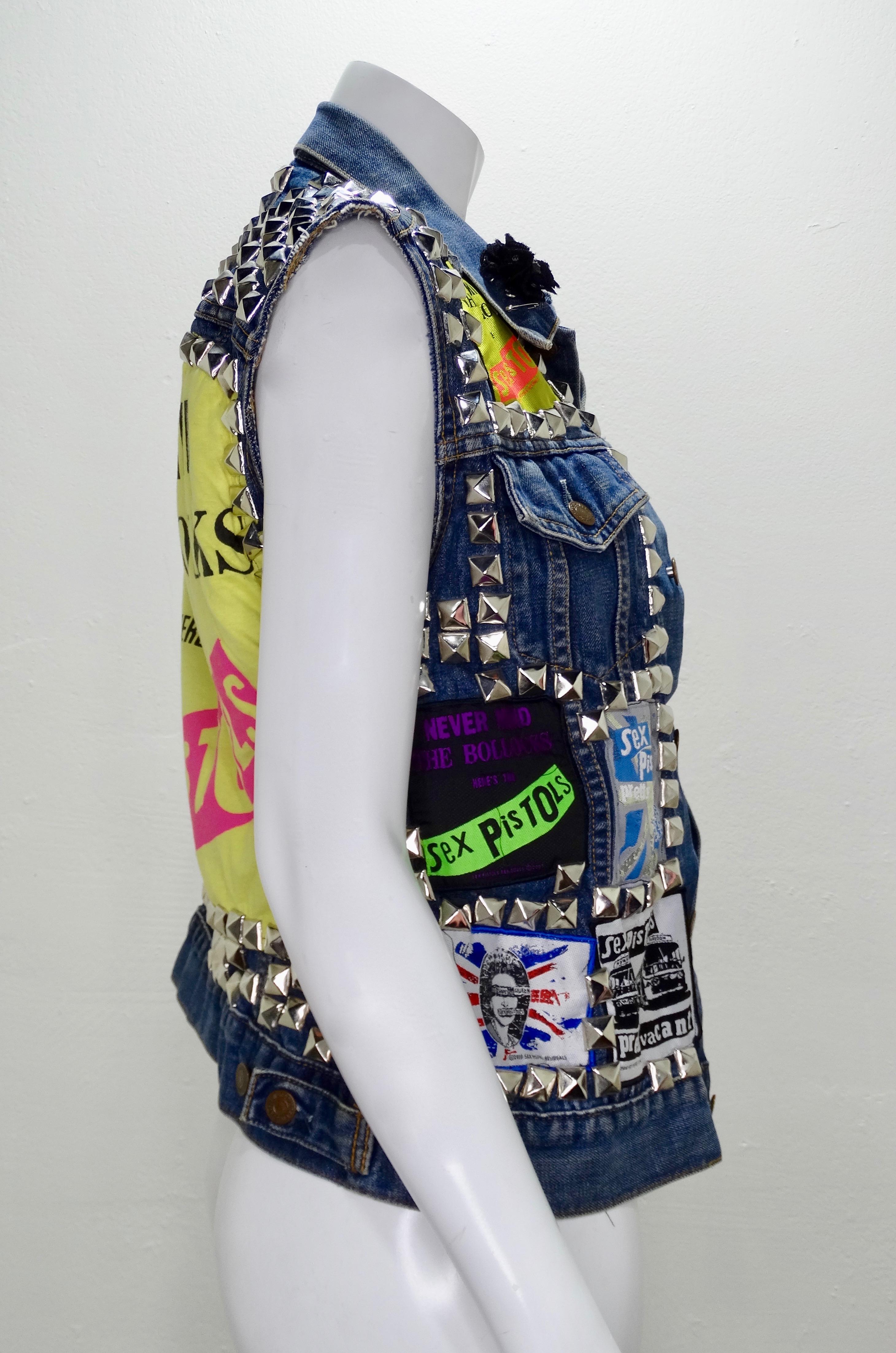 Add a little steampunk to your look with this amazing Levi's vest! An original Levi Strauss & Co. denim vest from the 1970s/1980s embellished with a variety of Sex Pistols patches (circa 2007-2010), silver studs, and safety pins. Perfect to layer