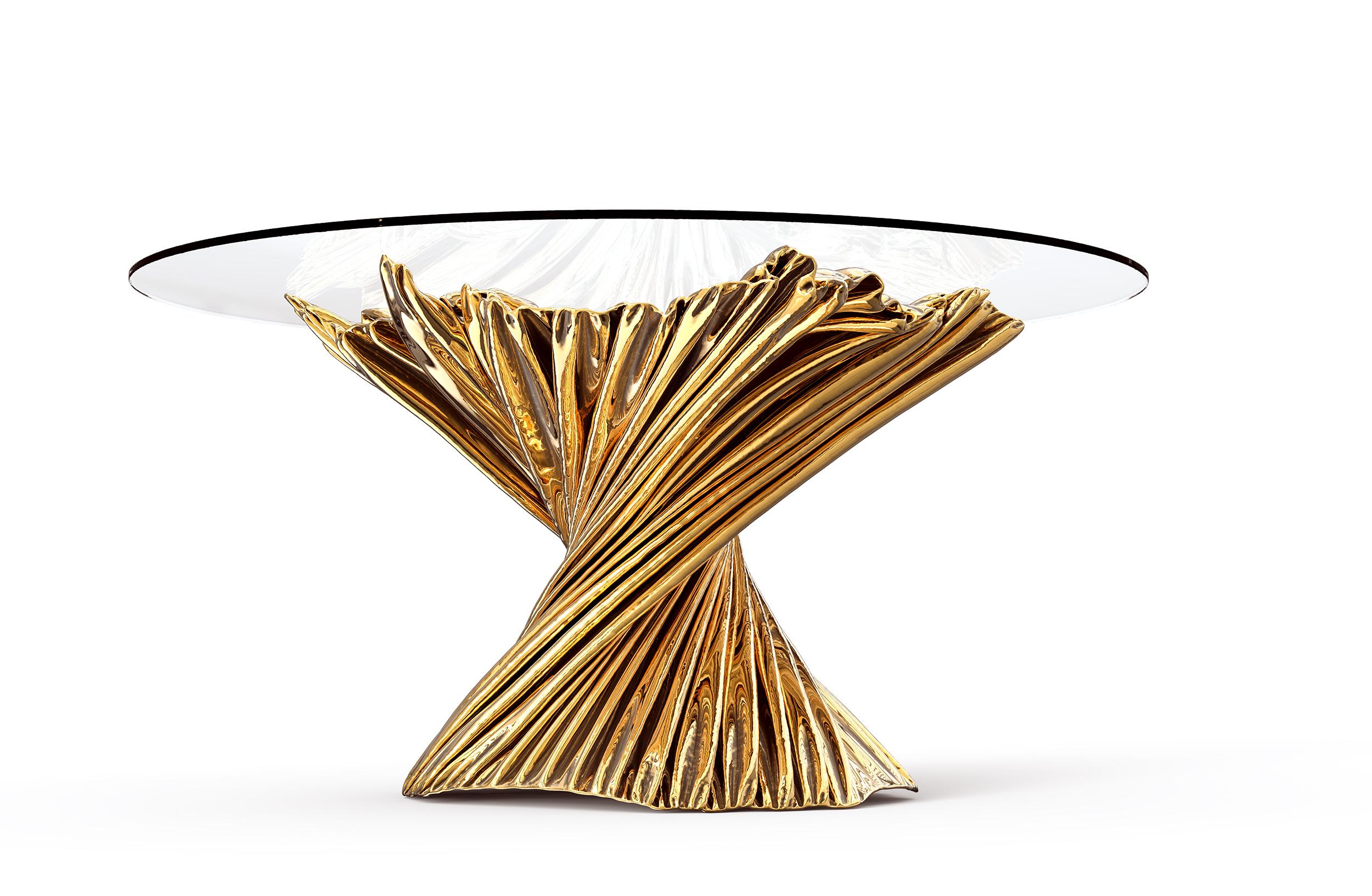 The Levitaz Dining Table stands as a sculptural centerpiece, a testament to the fusion of timeless material and modern aesthetics. Cast in bronze, its form is a series of cascading contours, polished to a mirror finish that captures and reflects the