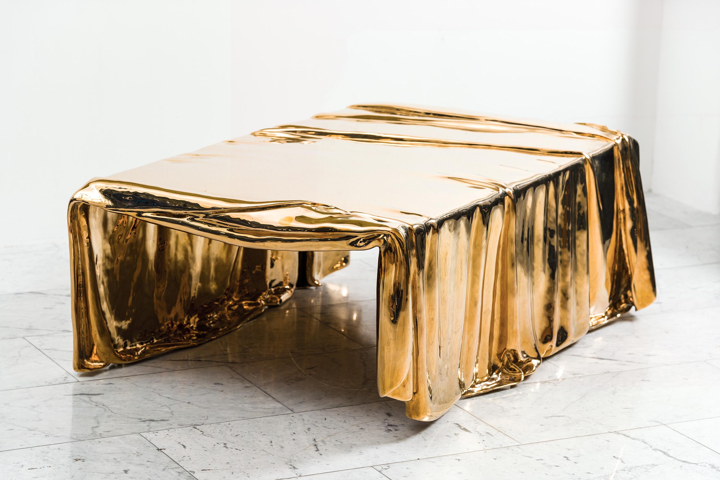 Vela Coffee Table, from the Levitaz Collection, embodies contemporary design through its unique marriage of material and form. Cast in bronze, this coffee table takes on the illusion of fluidity, with a surface that seems to drape and fold over