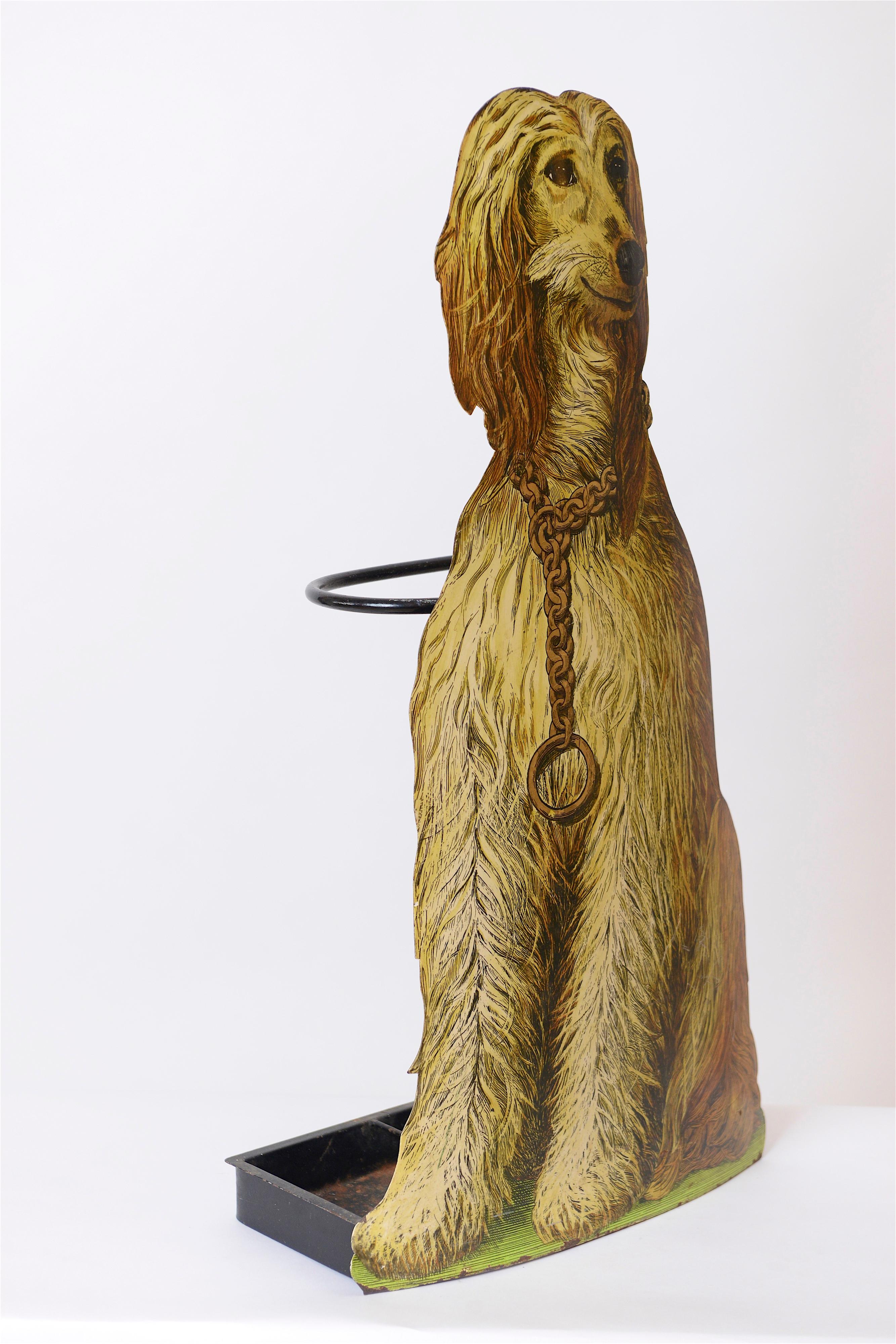 A 1960s ‘Afghan Hound’ umbrella stand by the incredibly creative, Piero Fornasetti. One of eight trompe l’oeil dog umbrella stands he created, this slender, long haired canine is portrayed in a seated position, sporting a large gold neck chain.