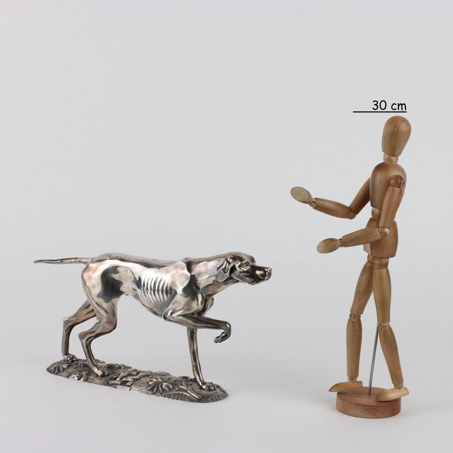 Finely chiseled silver greyhound. On the base and below the base engraved maker's and silver marks. 2222 grams.