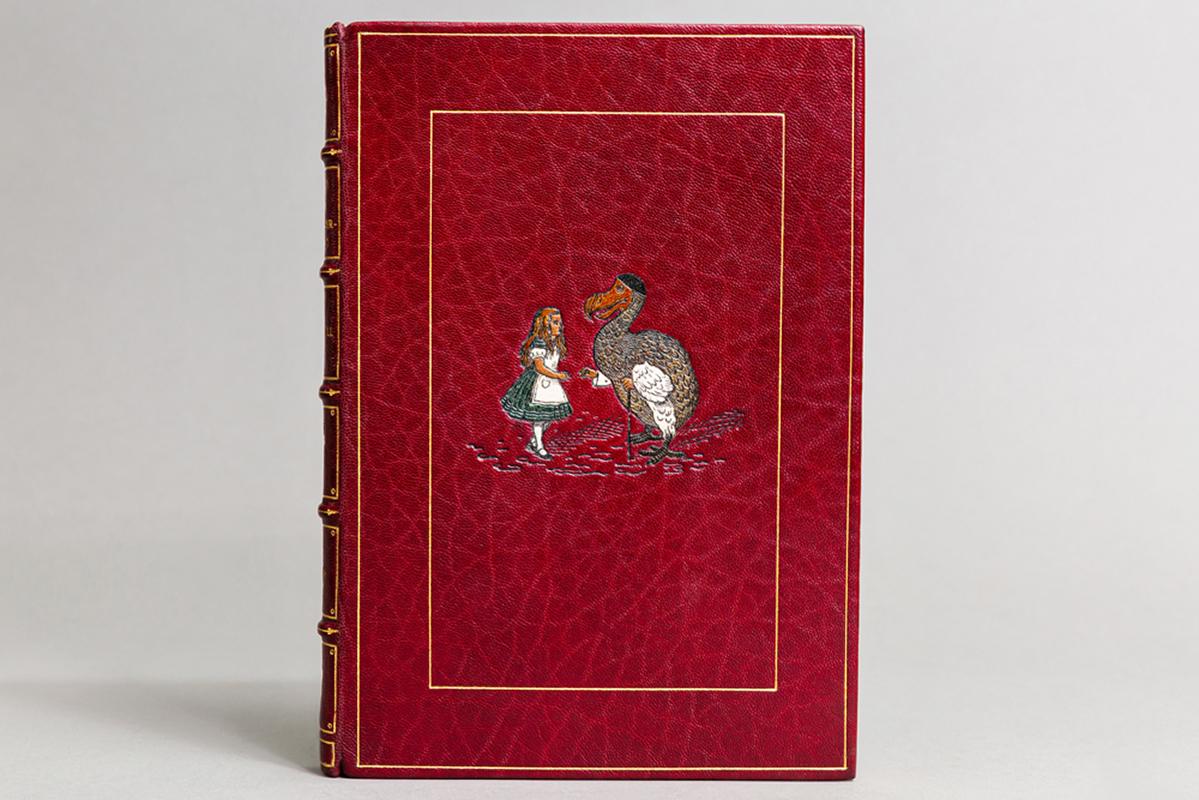 1 volume. 

Illustrations by John Tenniel. Bound in full red
Morocco with multi-colored onlay of Alice on front cover by Bayntun, top edges gilt, raised bands, gilt
Panels, printed on handmade Riccardi Paper, limited to 1000 copies, This is