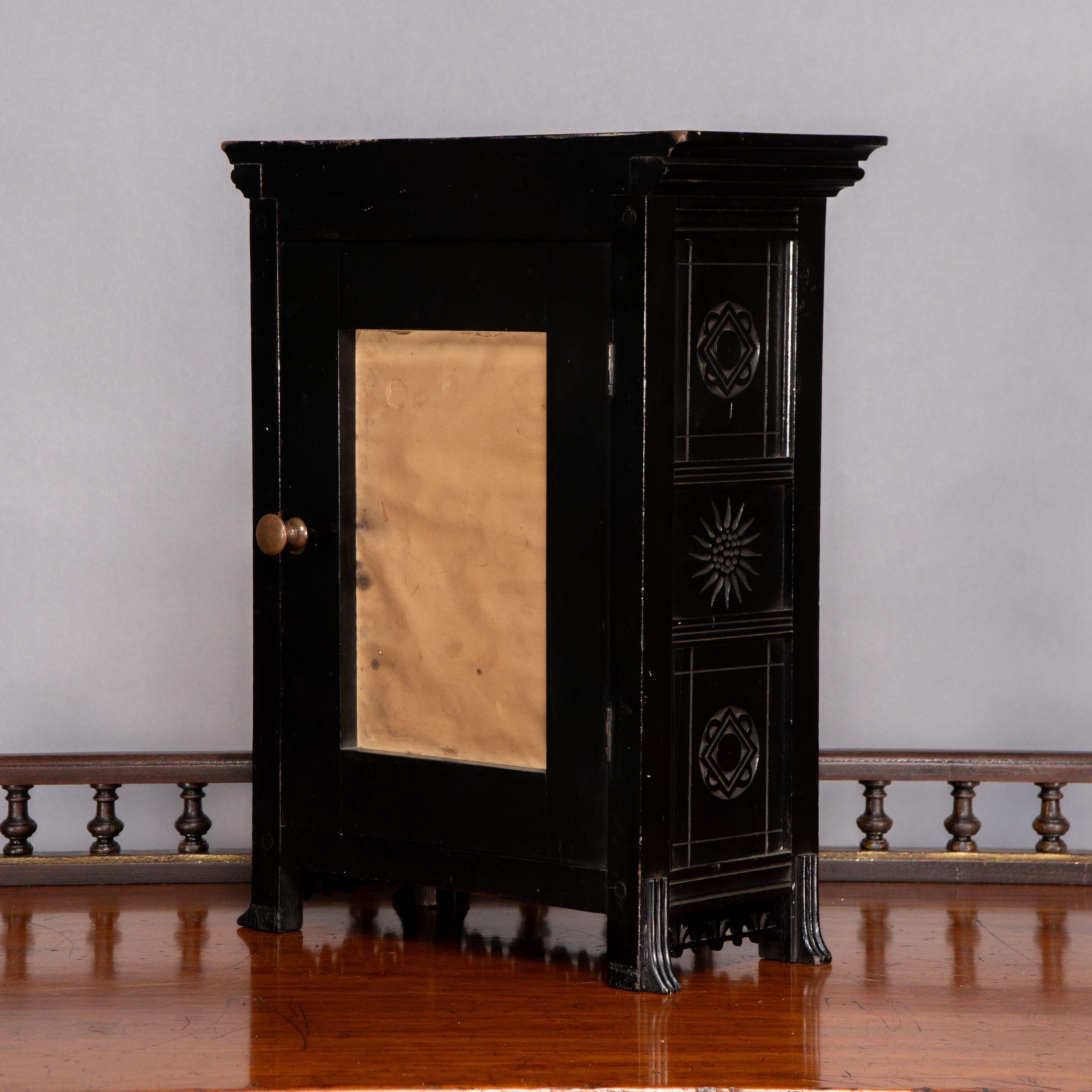 Late 19th Century Lewis Foreman Day. Made by Howell and Sons. An Aesthetic Movement ebonized clock For Sale