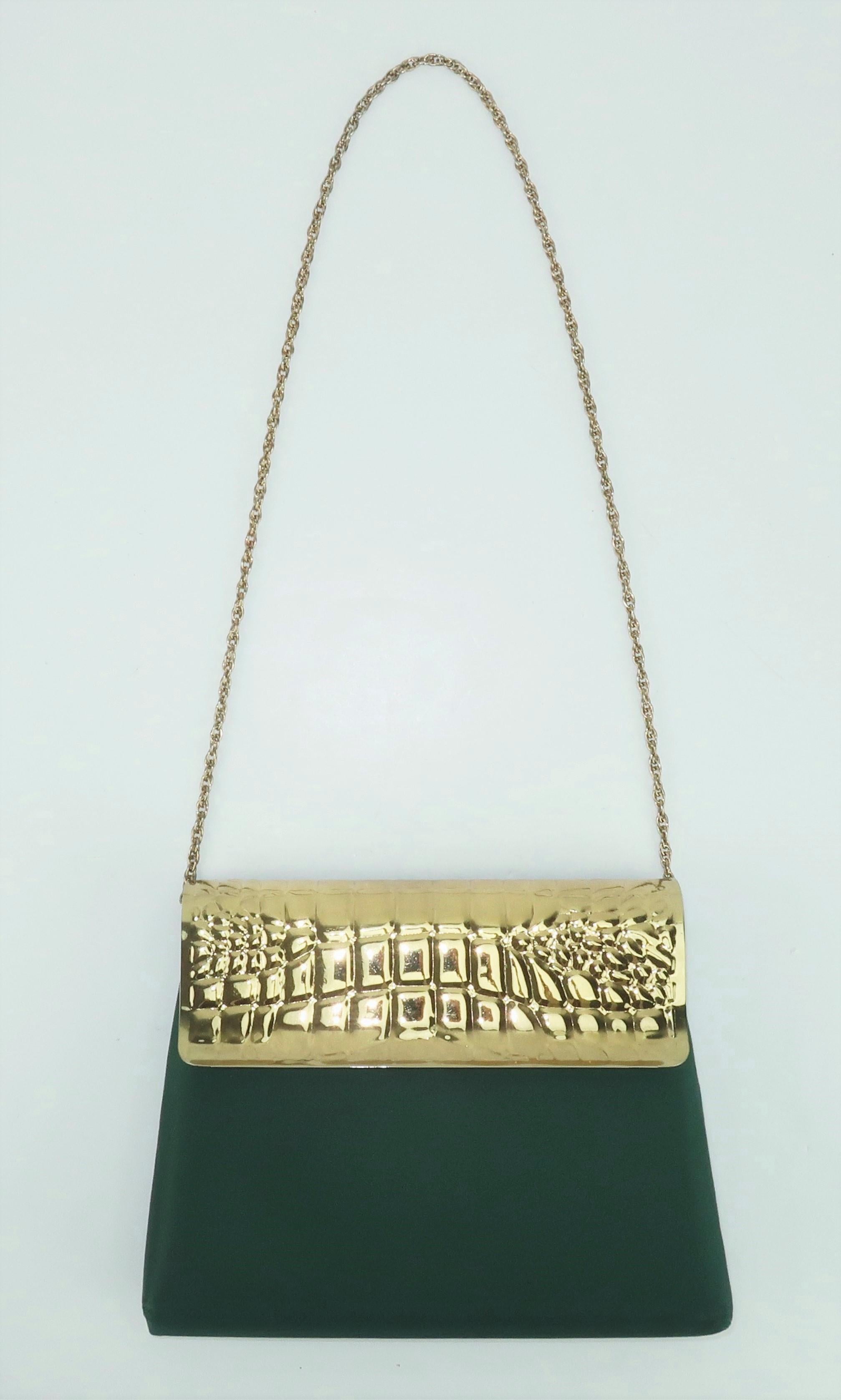1970's Lewisette dark green satin handbag with a unique alligator embossed gold metal flap snap closure and a braided chain shoulder strap.  The interior is lined with a butter yellow satin and the chain strap is a drop-in design providing the