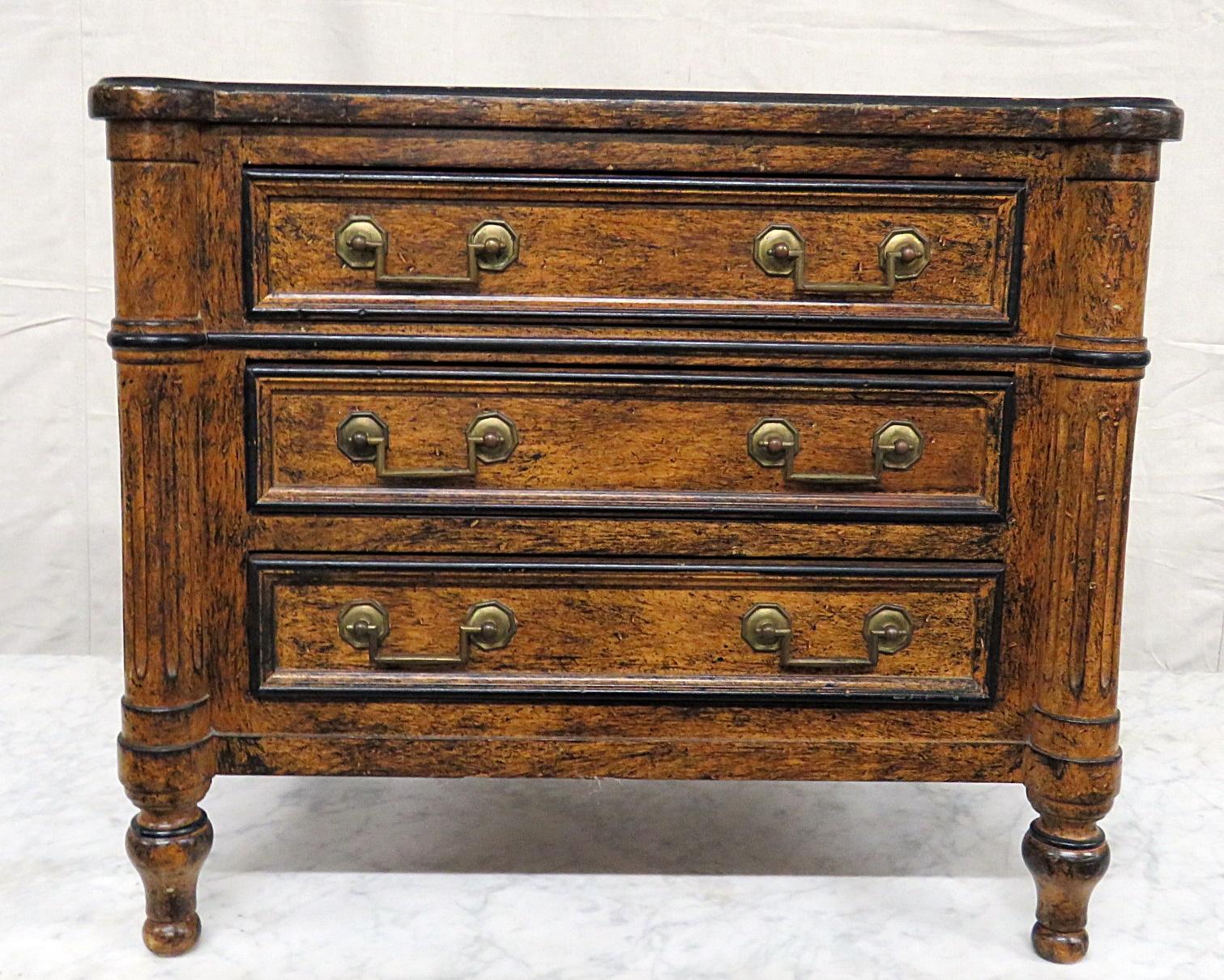 Lewis Mittman 3-drawer petite commode with a distressed finish and ebonized accents.