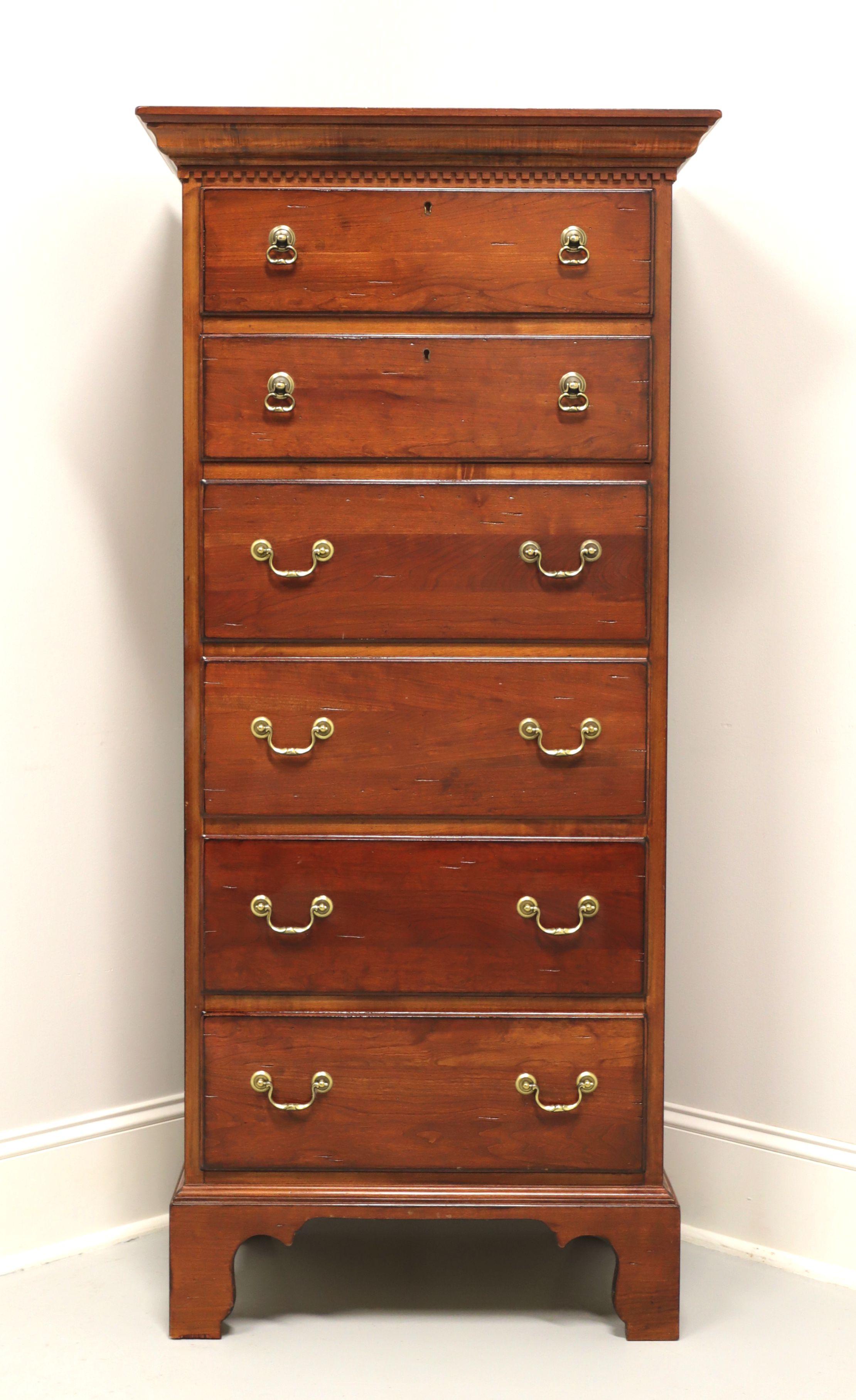 A Chippendale style lingerie chest from quality furniture maker Lexington, from their Bob Timberlake collection. Solid cherry with a distressed finish, crown & dentil molding to top, brass hardware and tall bracket feet. Features six drawers of