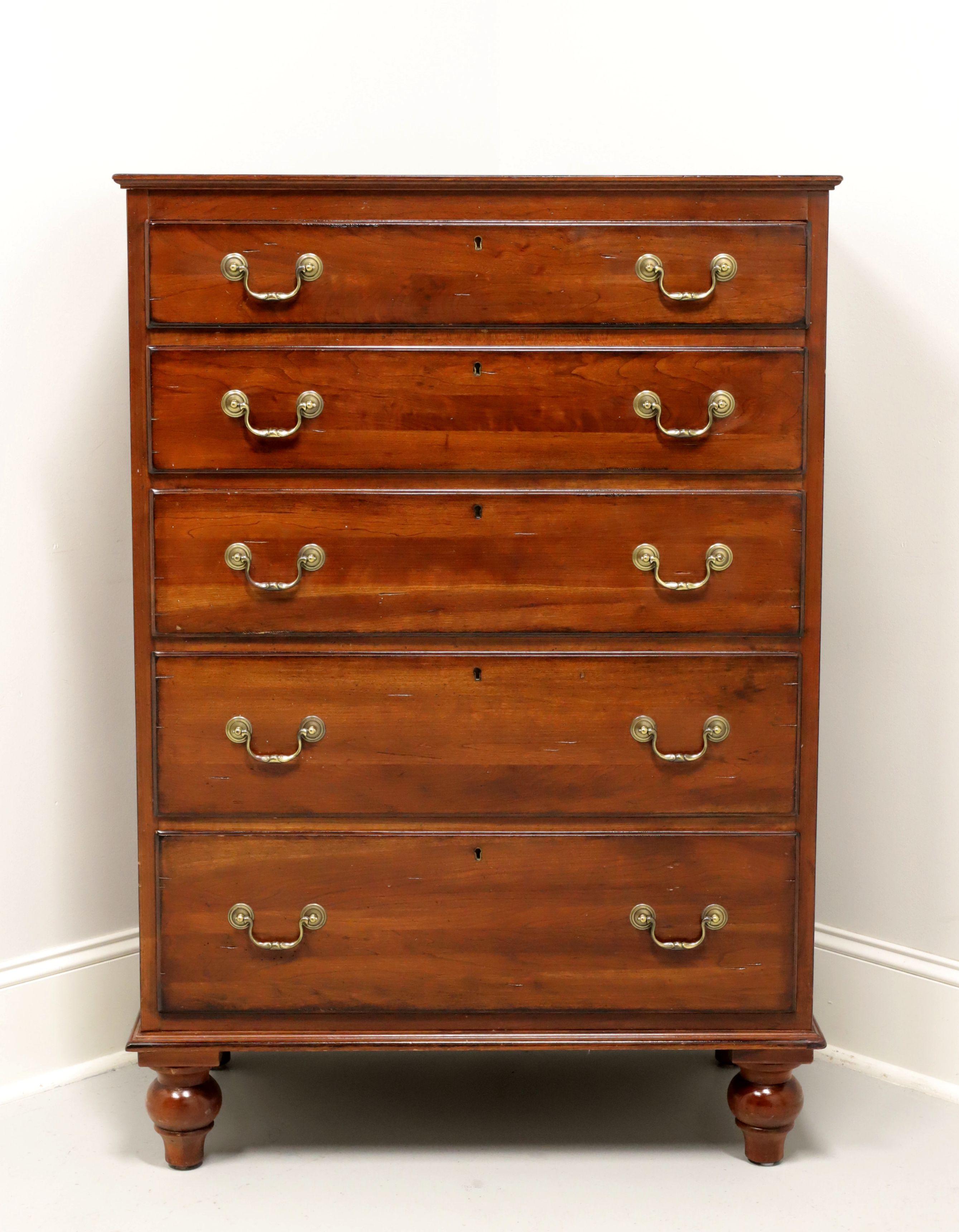A Chippendale style chest of drawers from quality furniture maker Lexington, from their Bob Timberlake collection. Solid cherry with a distressed finish, paneled sides, brass hardware and tall turnip feet. Features five various size drawers of