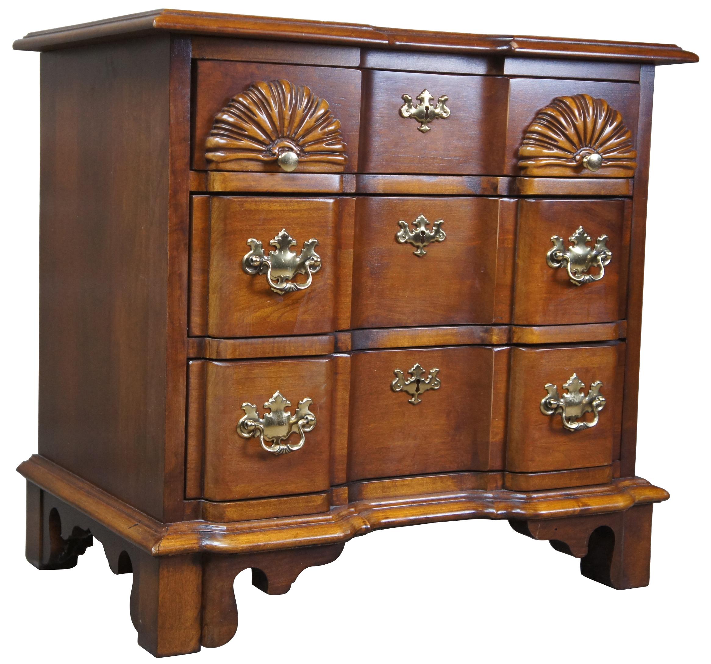 Vintage Lexington Furniture Goddard or block front chest. Made from cherry featuring Chippendale styling, carved accents and brass hardware.
 