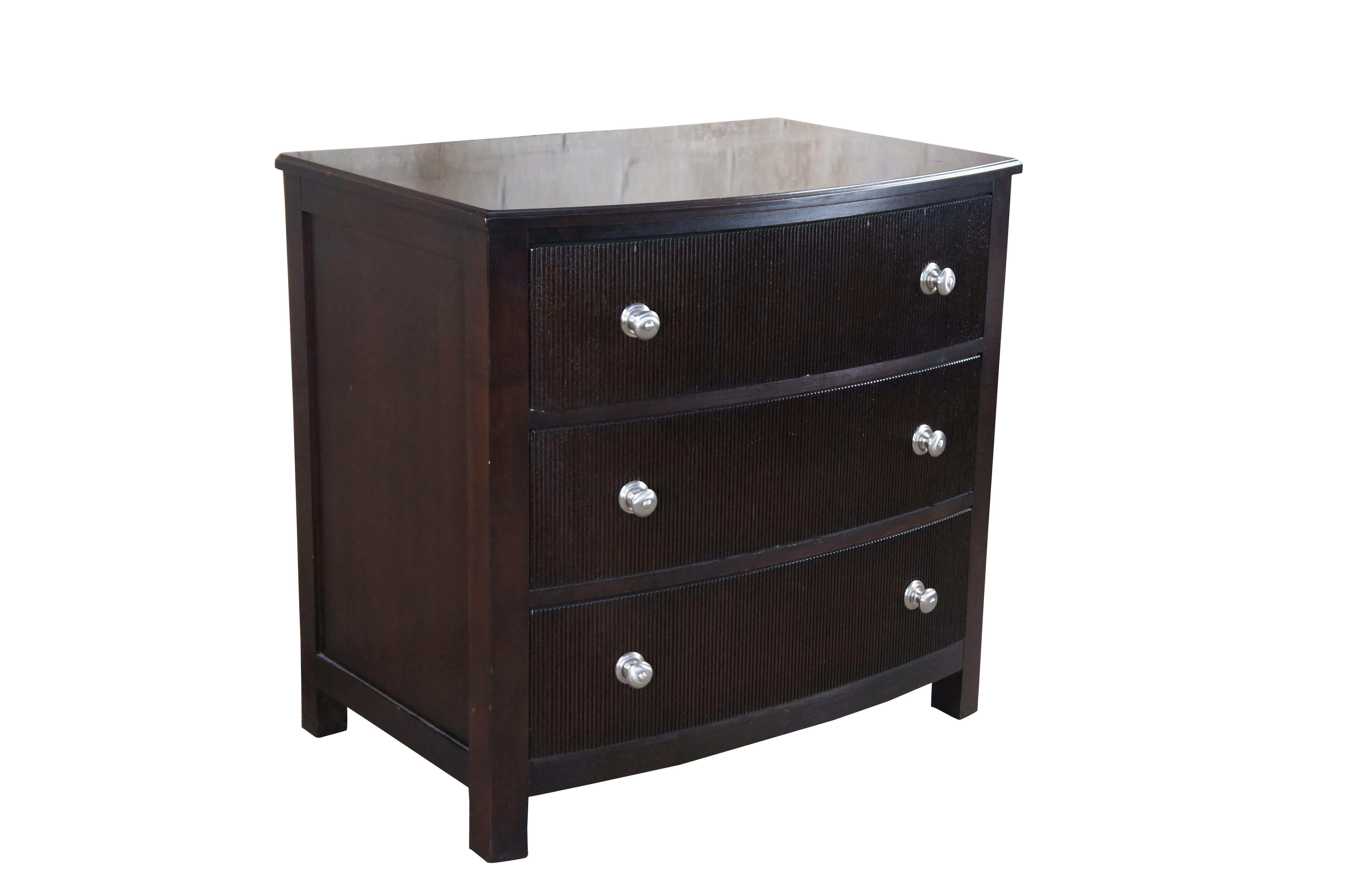 Nautica Home by Lexington Furniture commode or bedside table. Features a bow front with three dovetailed drawers. Drawer fronts are reeded with silver rounded pulls. Finished in cherry

DIMENSIONS

21