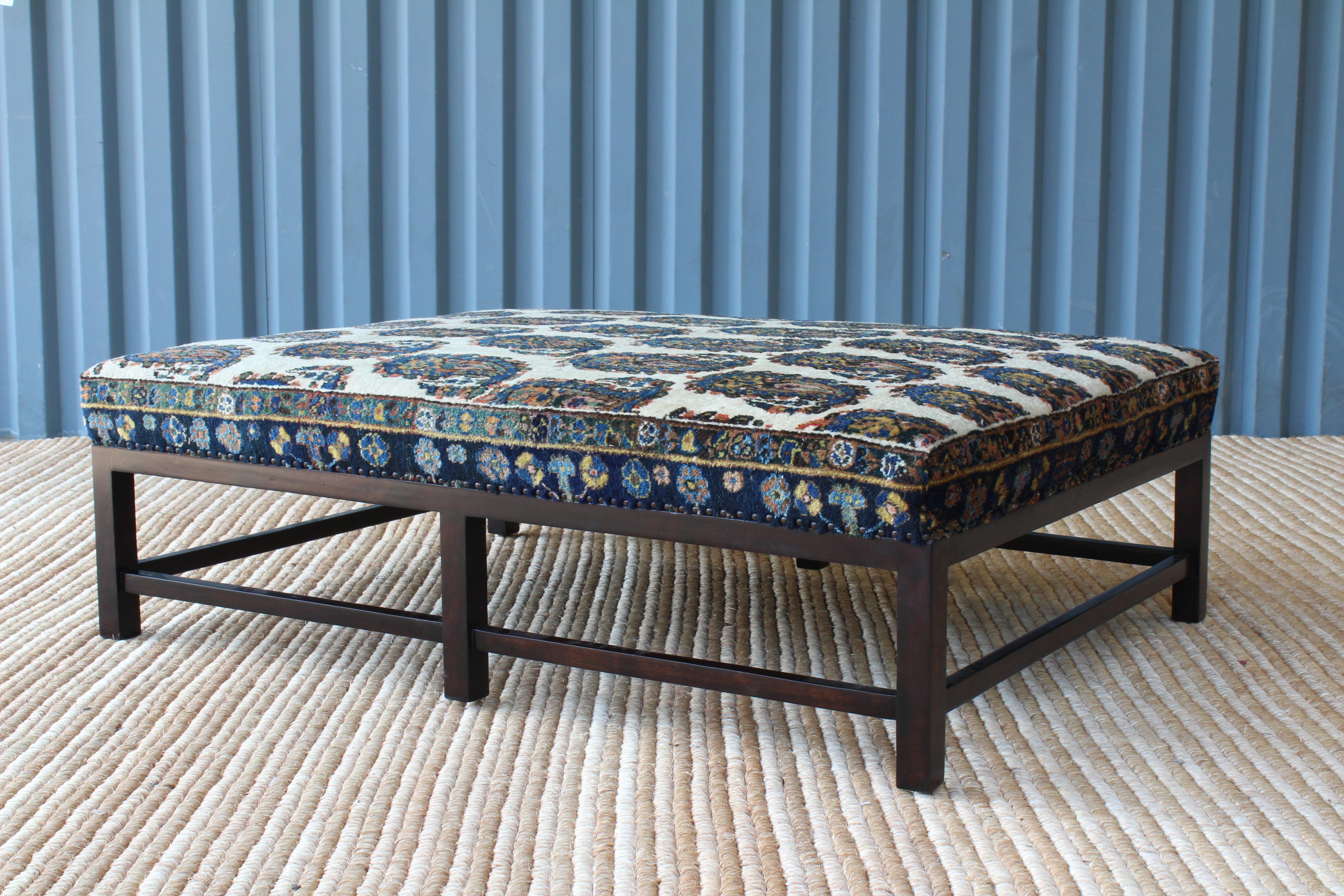 Lexington ottoman by Hollywood at Home, upholstered in a vintage paisley rug.
