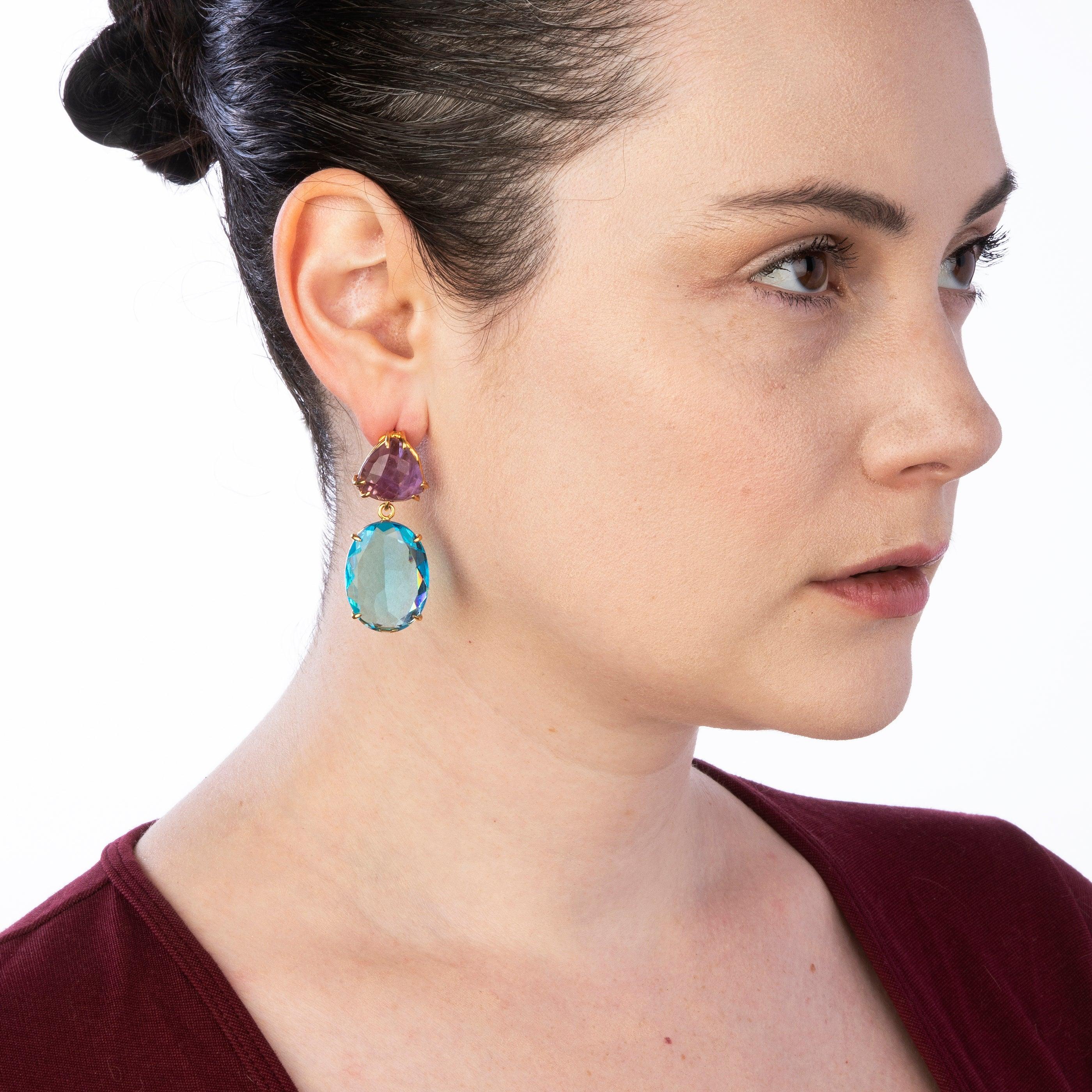 The Leyla Earrings, exude a captivating charm that's perfect for summer. Their vintage and retro style adds a touch of elegance to any ensemble. With a removable drop feature, these earrings offer versatility, allowing you to wear them as studs for