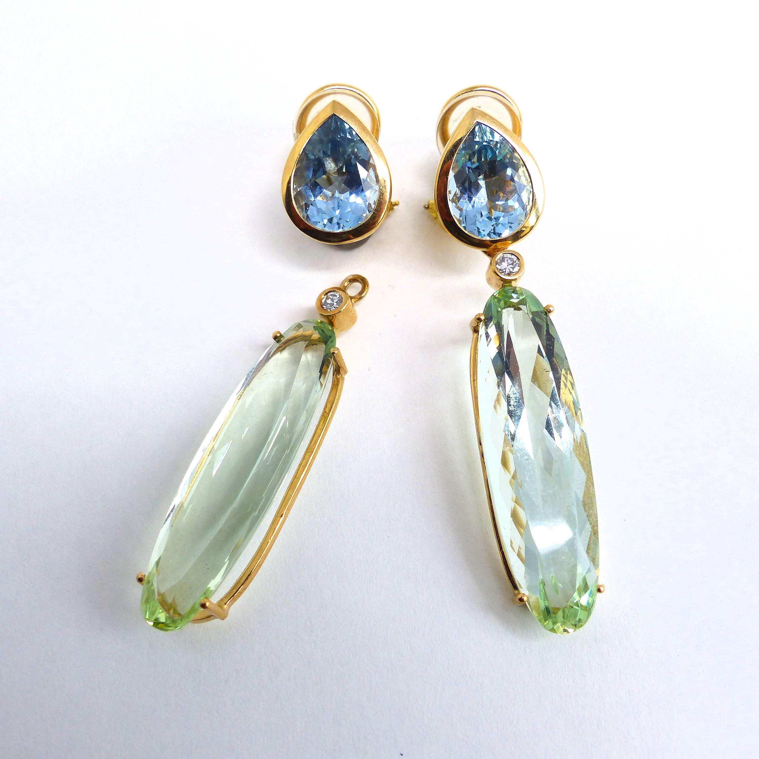 A stunning pair of earrings in 18k Rose Gold, showcasing:

- 2 fine Aquamarines (pear-shaped, 12x9mm, 6.01ct)
- 2 exquisite Green Beryls (35x10.5mm, 33.68ct)
- 2 brilliant-cut Diamonds (2.2mm, TW/VVS, 0.29ct)	
