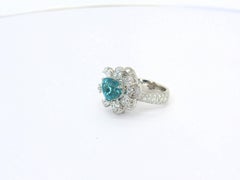 Ring in Platinum with 1 blue/green Paraiba Tourmaline Heartshape and Diamonds