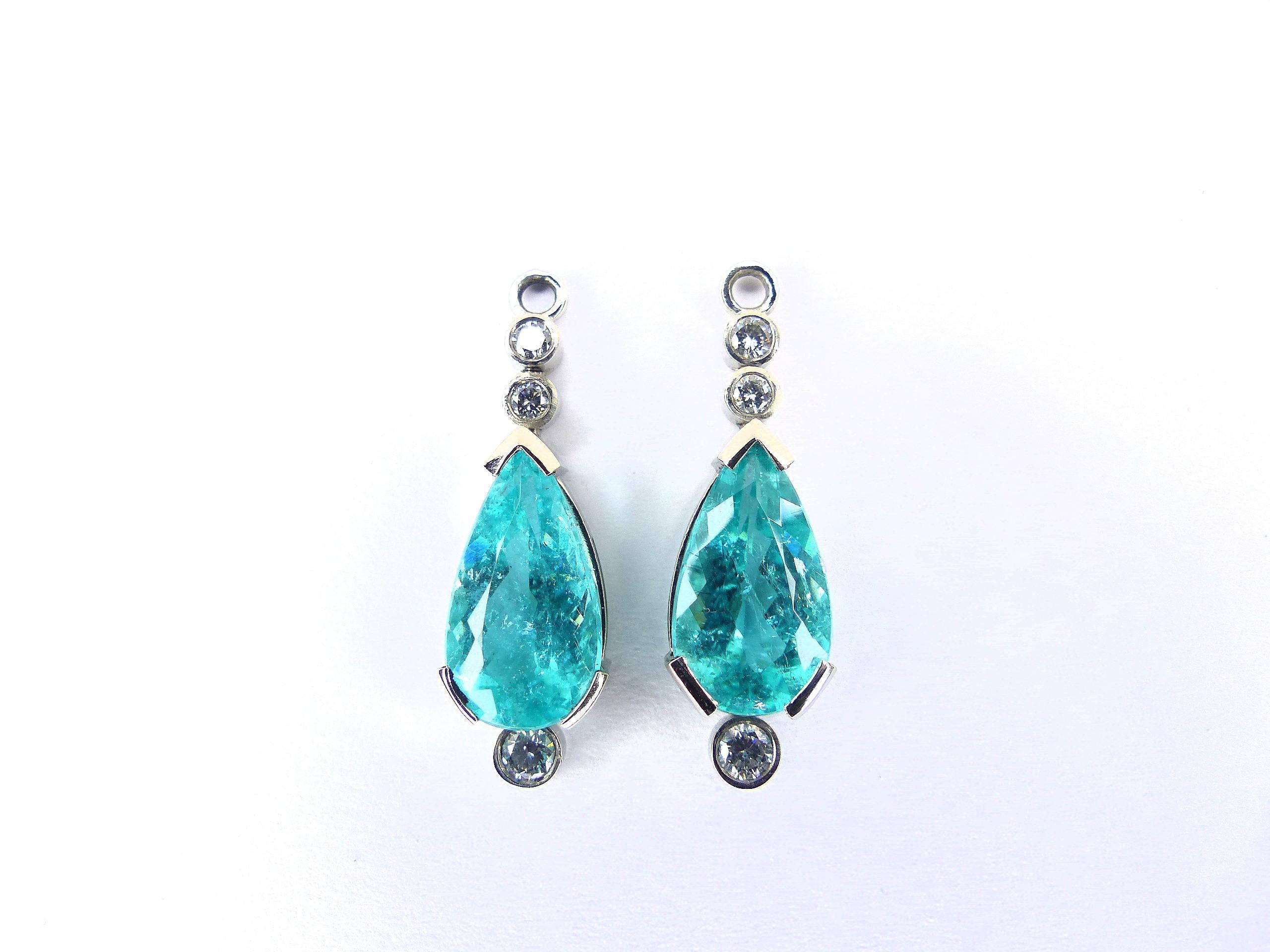 This pair of 950/ Platinum (7.50g) Drop Earrings are set with 2x fine blue/green Paraiba Tourmalines (facetted, pear-shape, 15x8mm, 7.93cts) + 6x Diamonds (Brilliant-cut, D/VS, round, 2.5-3mm, 0.36cts).

Paraiba Tourmalines are very popular and rare