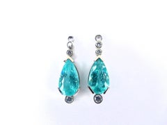 Earrings in Platinum with 2 green Paraiba Tourmaline Pearshapes and 6 Diamonds