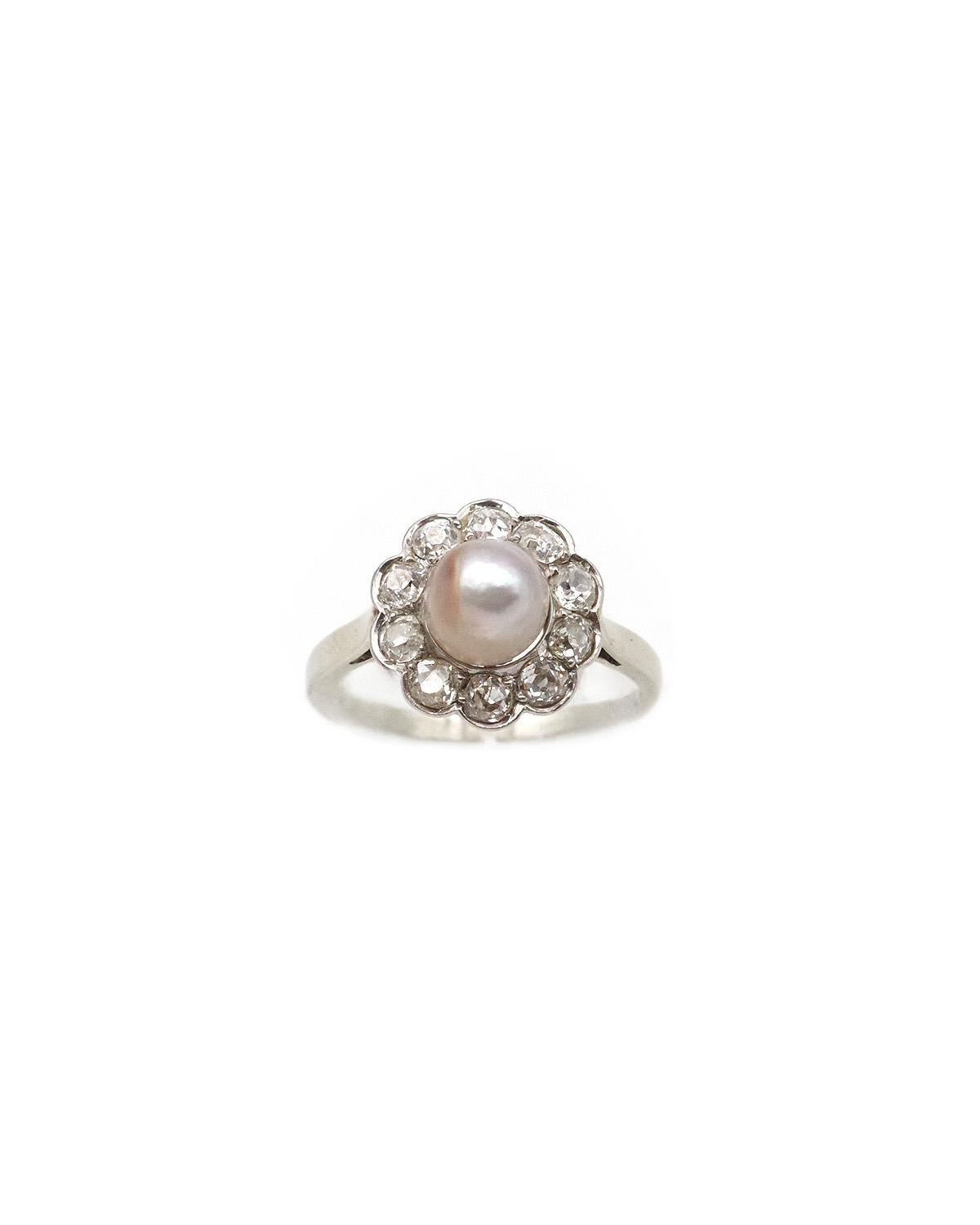 Certified natural pearl cluster ring in 18 karat gold and platinum. Daisy ring centered with a fine pearl surrounded by 10 antique-cut diamonds in a bezel setting. The fine pearl measures 6.7 mm in diameter and its color is white with a light gray