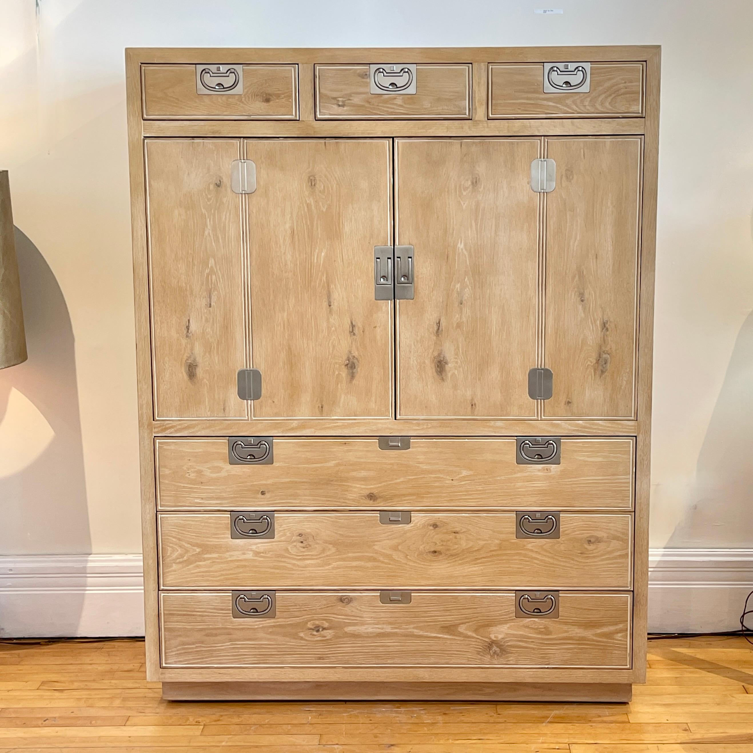 Stunning and solid bleached and cerused oak large cabinet with drawers, Consists of three charming upper drawers, with two doors that open wide. Inside is one movable shelf with removable sections. Shelf can also be easily removed entirely so