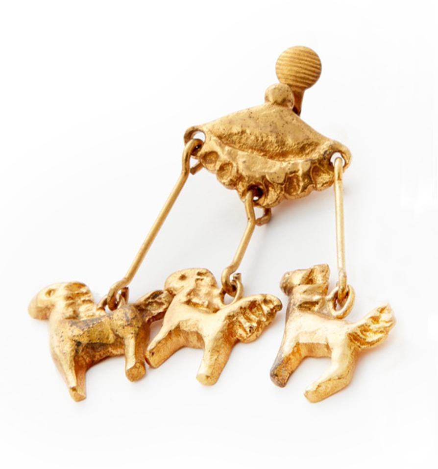 Line Vautrin, Carrousel, c. 1945, clip-on, gilt-bronze, limited edition. 

Line Vautrin (1913-1997) French artist, jewellery and designer worked in a range of experimental mediums including resin, glass and bronze taking the form of jewellery and