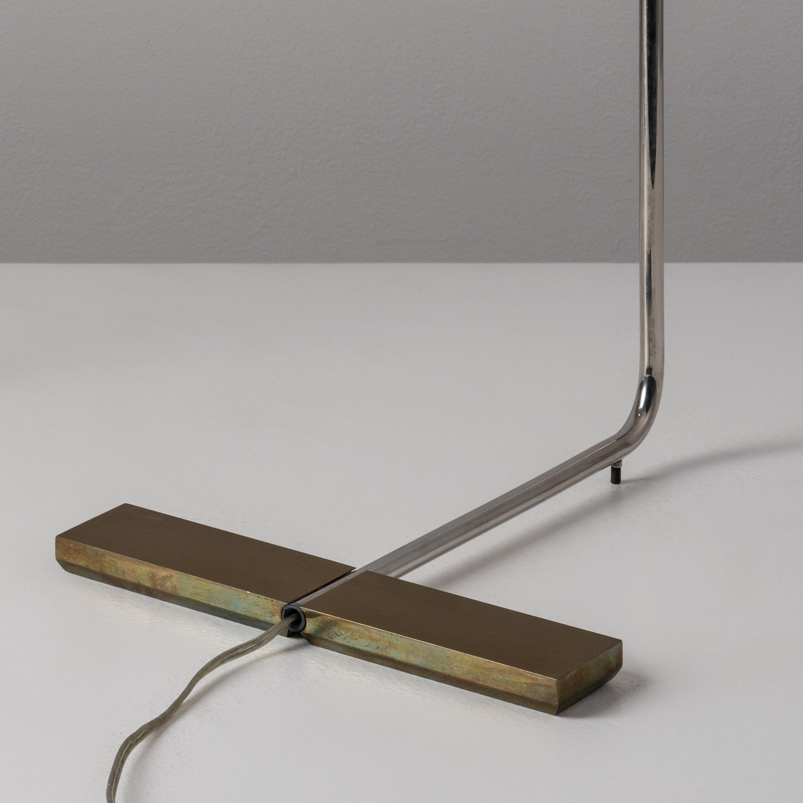 LH floor lamp by Cedric Hartman. Designed and manufactured in the USA, circa 1968. Polished nickel, paired with polished brass throughout these floor lamps. An acrylic knob at the shade operates dimmer. Height can be adjusted between 60-65