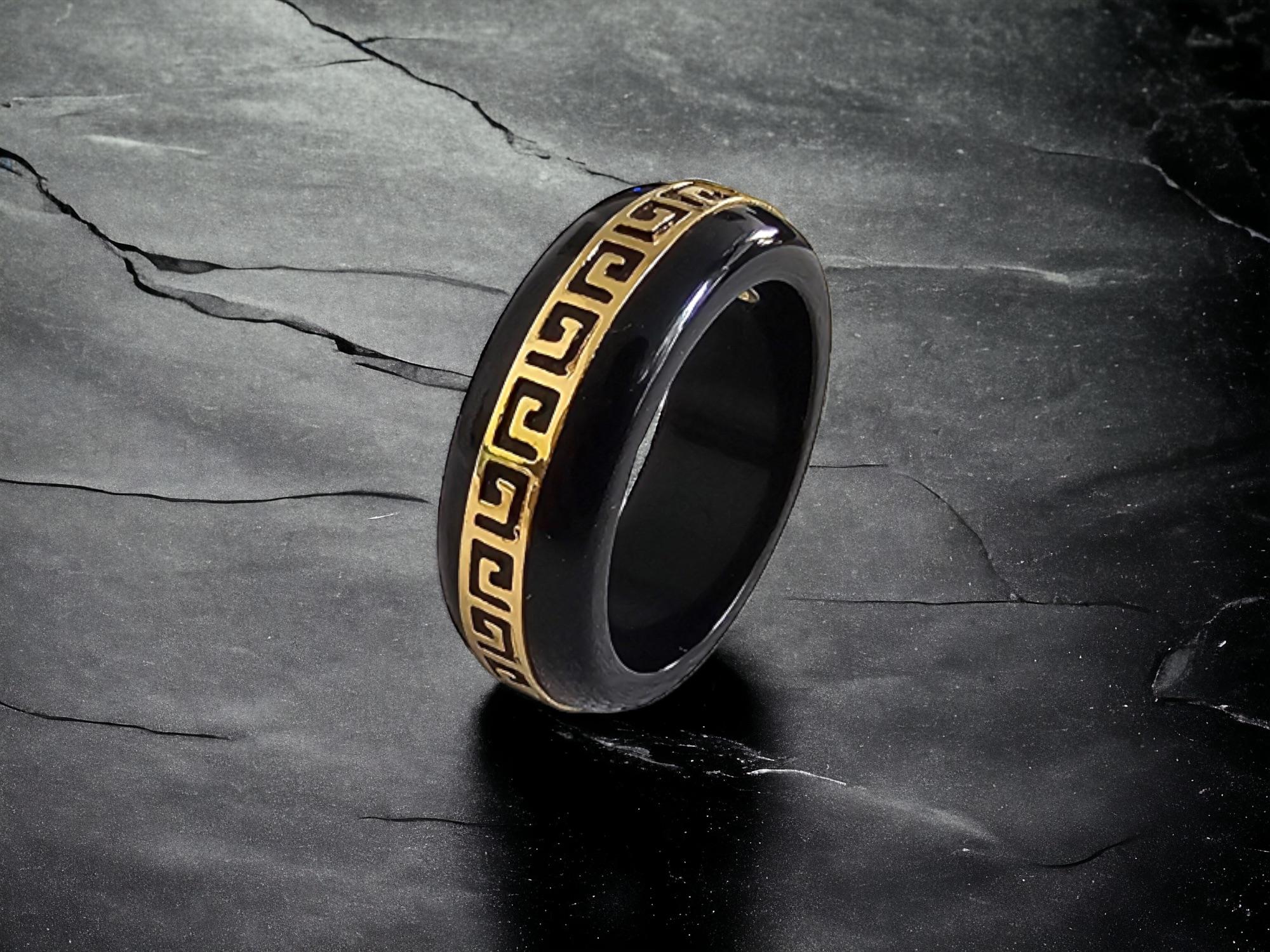 Black Onyx Band Ring with solid 14K Yellow Gold (Hallmark Stamped) for men and women (unisex). 

The infinity band style is perfect for casual and formal wear, easy to dress up. 

The 'Li' rings are named after the Chinese character for Strength. A