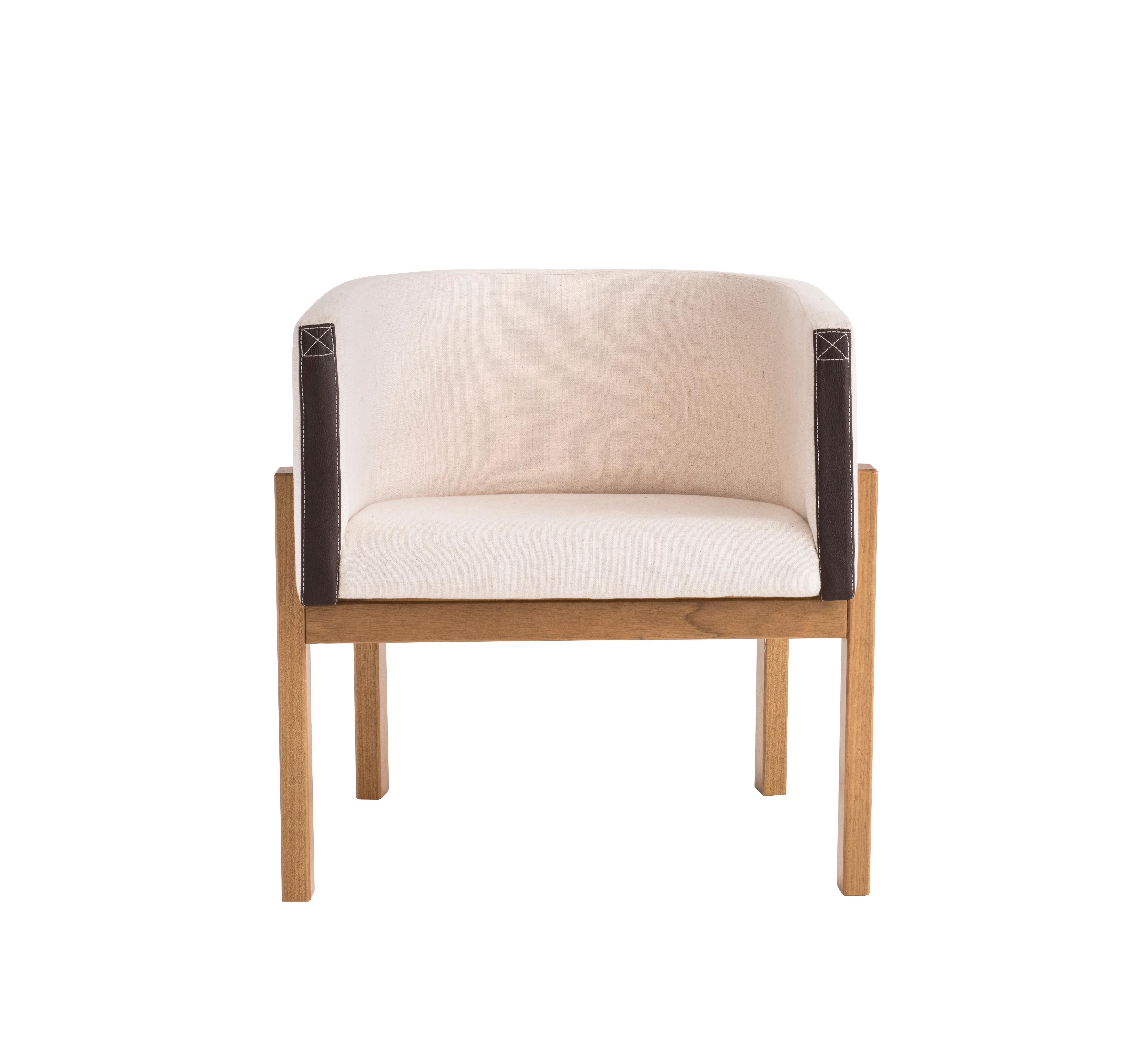 Liame means anything that has the purpose of connecting, uniting or holding. The Liame armchair stands out for its clean and timeless design. Natural wood base and shell is upholstered in linen. Details with stitched synthetic leather straps finely