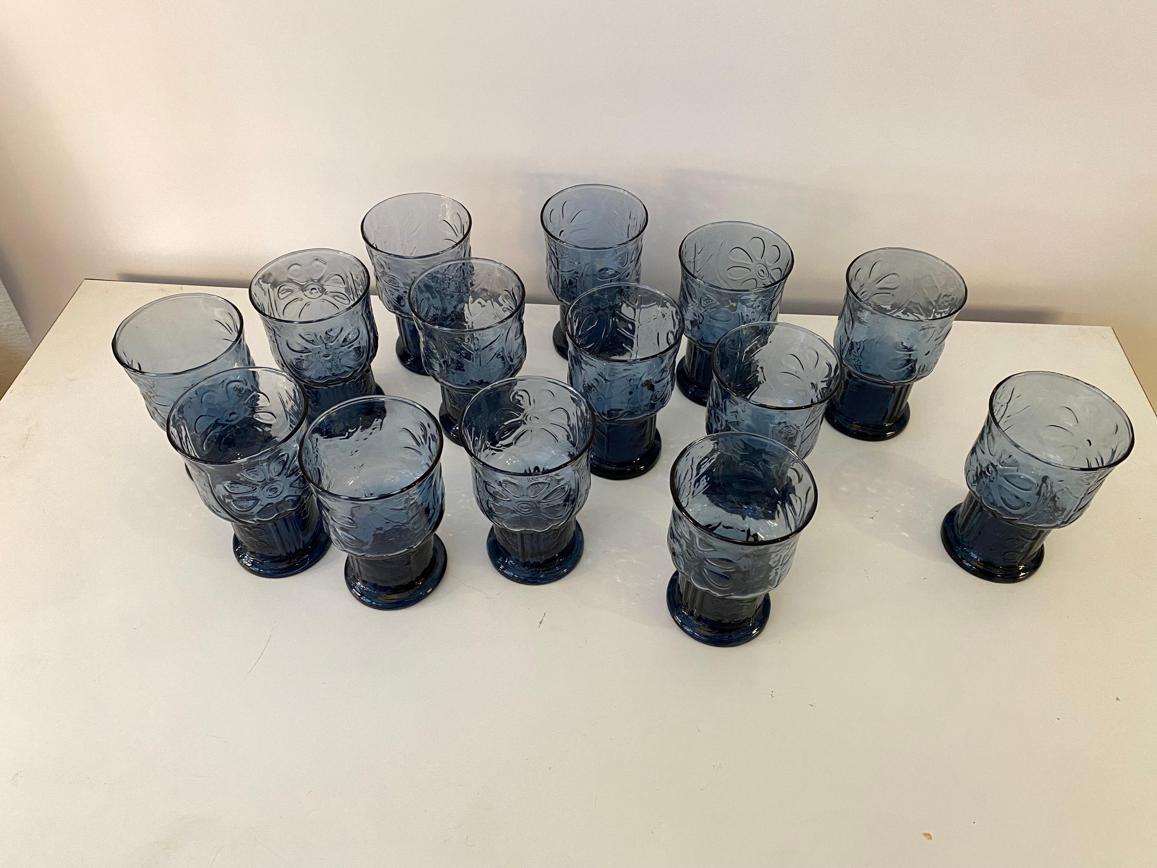 Libbey Glass Company, set of 14 country garden drinking glasses. Glass is a light blue, with a slightly footed base design. Classic 1970's Chic!