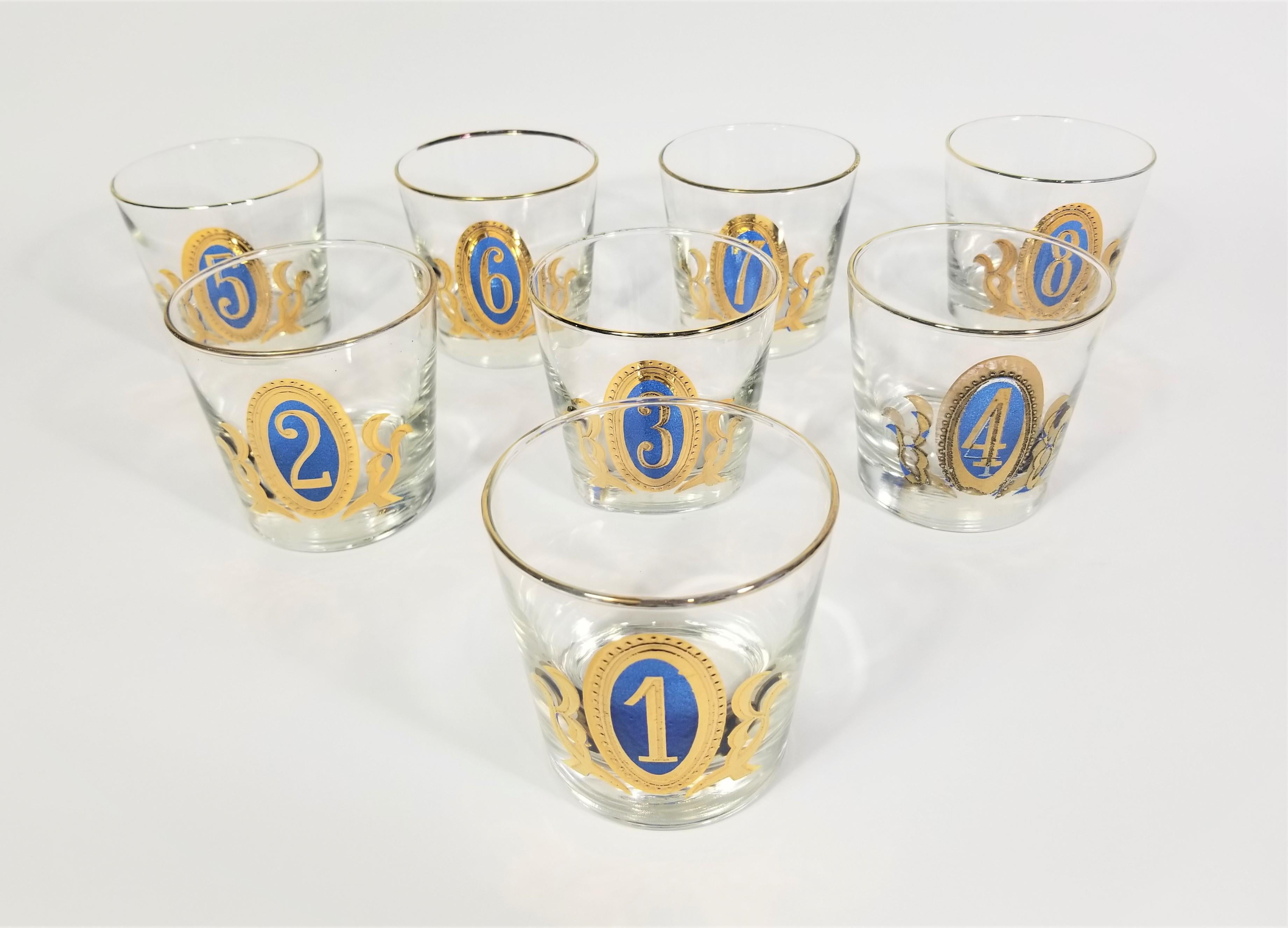 Mid century 1960s Rare Libbey Glassware Barware “Numero Design Crown Collection” 9oz. Old Fashioned Glasses numbered 1 to 8, Gold and blue. Unused and still in original box. All glasses marked on bottom with Libbey marking. The gold detail around