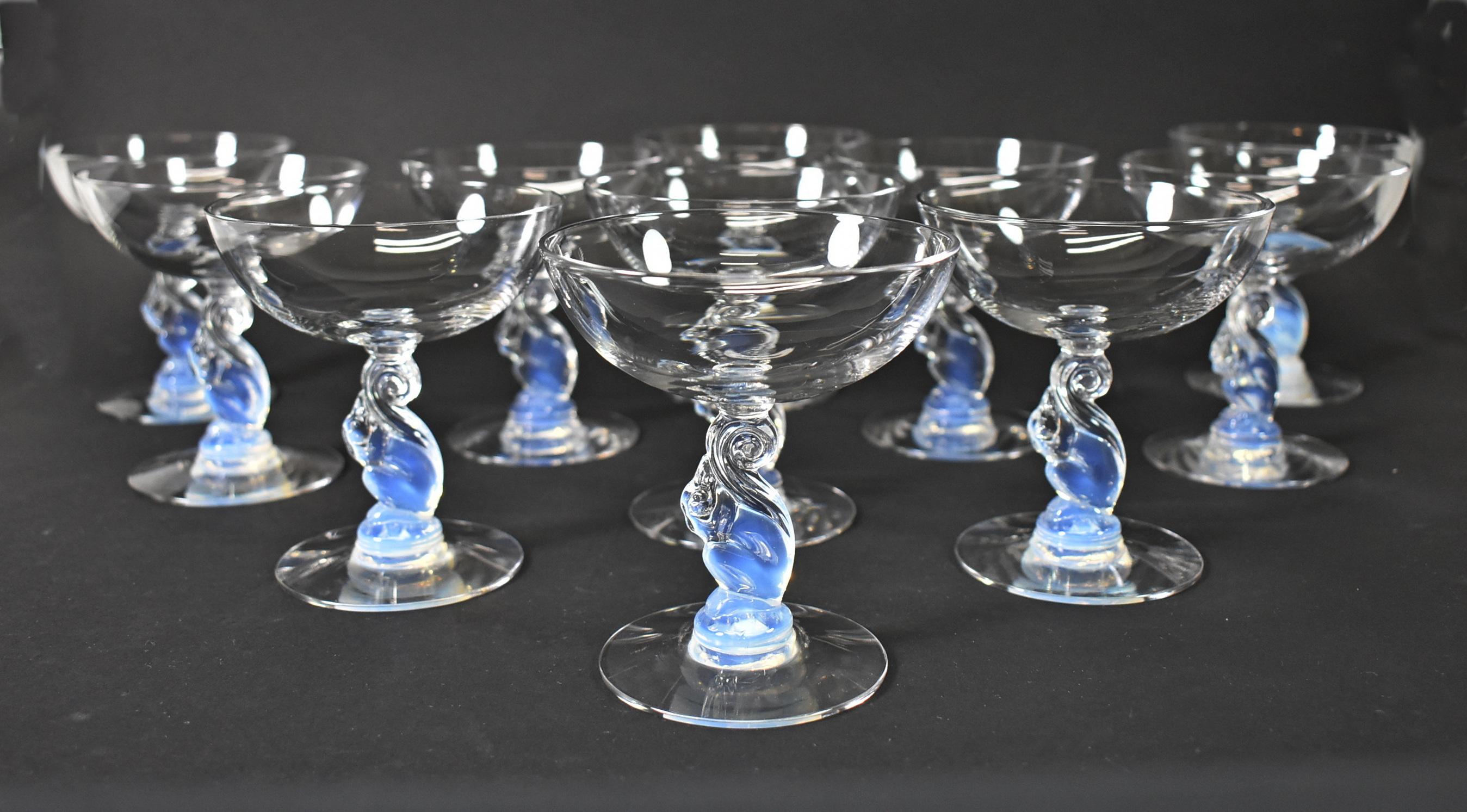 Rare 1933 Libbey Silhouette Nash Series moonstone champagne/sherbet glasses with charming squirrel stems in opalescent glass designed by Douglas Nash. Libbey mark is acid etched on the bottom. 3 7/8