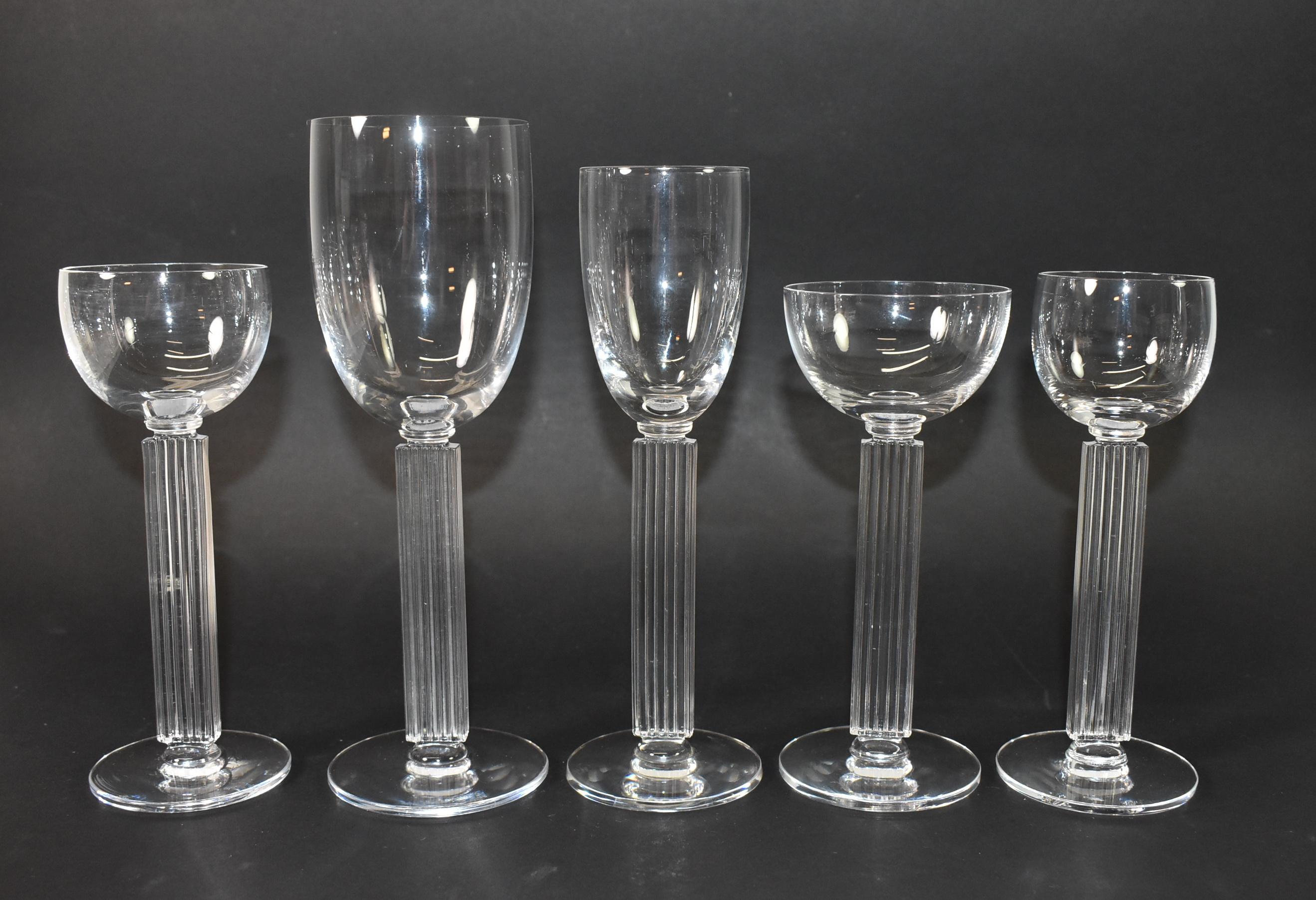 Designed by Walter Dorwin Teague and Edwin W. Fuerst for the State Dinning Room for the 1939 New York World's Fair. The fluted stem design was inspirated by the columns of the Federal Building, pattern #4900. This set of 23 contains water, wine and