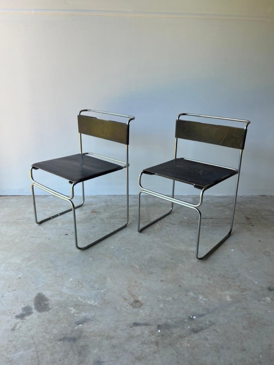 This chairs are stackable with structure in chrome and black fabric, backrest is stretched and held by springs. Unique slim minimalistic design. 

Giovanni Carini was an Italian architect and designer known for his contemporary and innovative