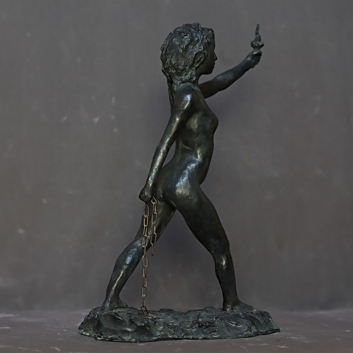 This marvelous bronze sculpture depicting a woman fiercely raising a torch - a symbol of freedom - in one hand and holding a broken chain - symbolizing the end of slavery - in the other is an original piece conceived as an ode to freedom. The