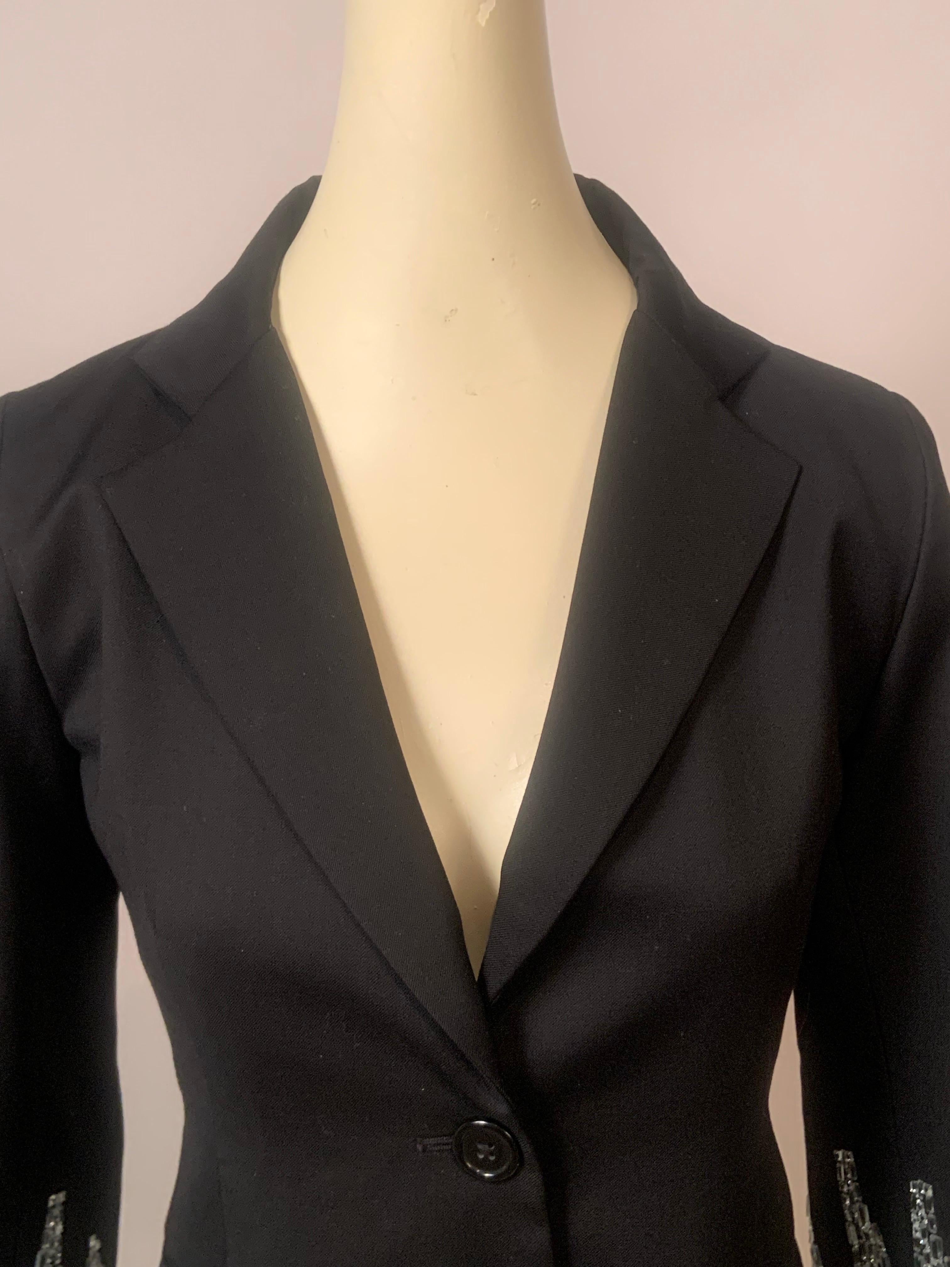 Crystal embellished Libertine, does it get any better than this sparkling black wool jacket designed by Johnson Hartig and handmade in Los Angeles, the home of Hollywood glamour.
The jacket is made from wool with a silken finish and embellished on