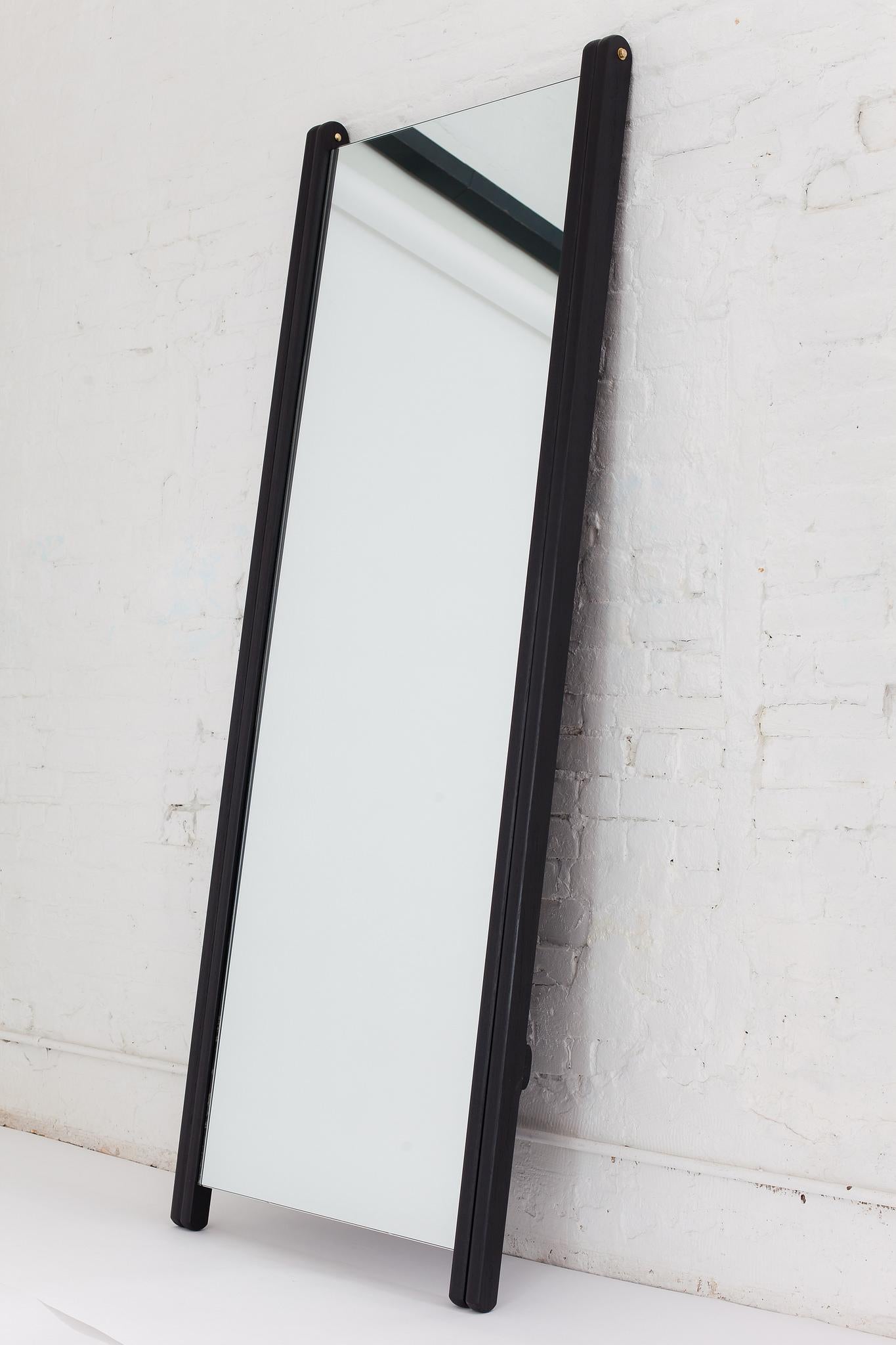 Large and luxurious, the Libertine mirror stands lightly on its tapered legs. Leave it open in the ‘compass’ position, or fold it flat to lean against the wall for a smaller footprint. A strong backing prevents the mirror from experiencing any