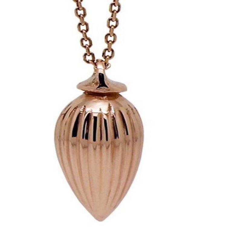 Made in solid 9 ct rose gold, this beautiful little drop is inspired from a perfume bottle stopper.

It sits on a fine 9 ct rose gold filed knife edge chain, that is adjustable in length from 16 inches to 18 inches.