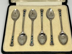 Liberty, a Fine & Rare Set of Six Art Deco Silver & Enamel Cased Coffee Spoons