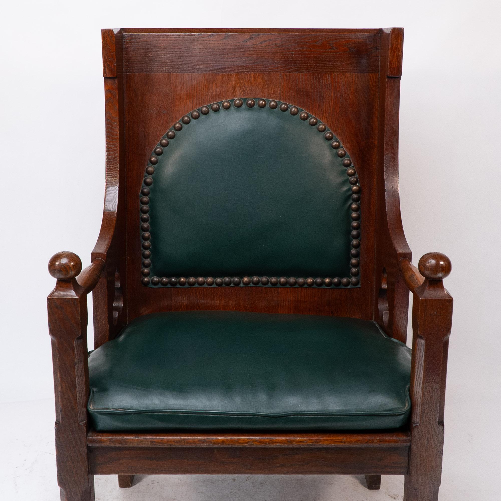 19th Century Liberty and Co. A good quality Arts and Crafts oak armchair with leather cushion For Sale