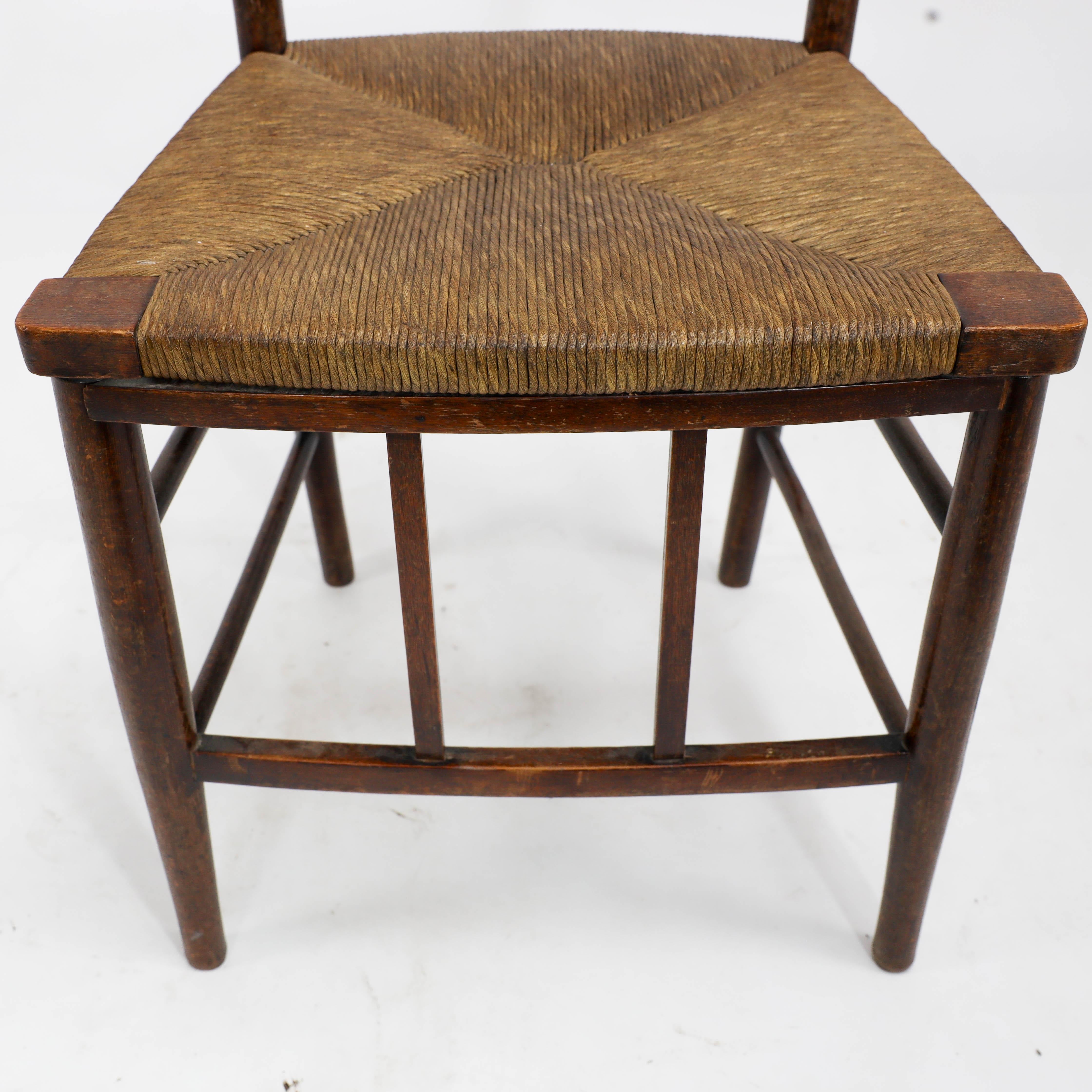 Liberty and Co, A pair of Arts and Crafts side chairs with finely rushed seats For Sale 1