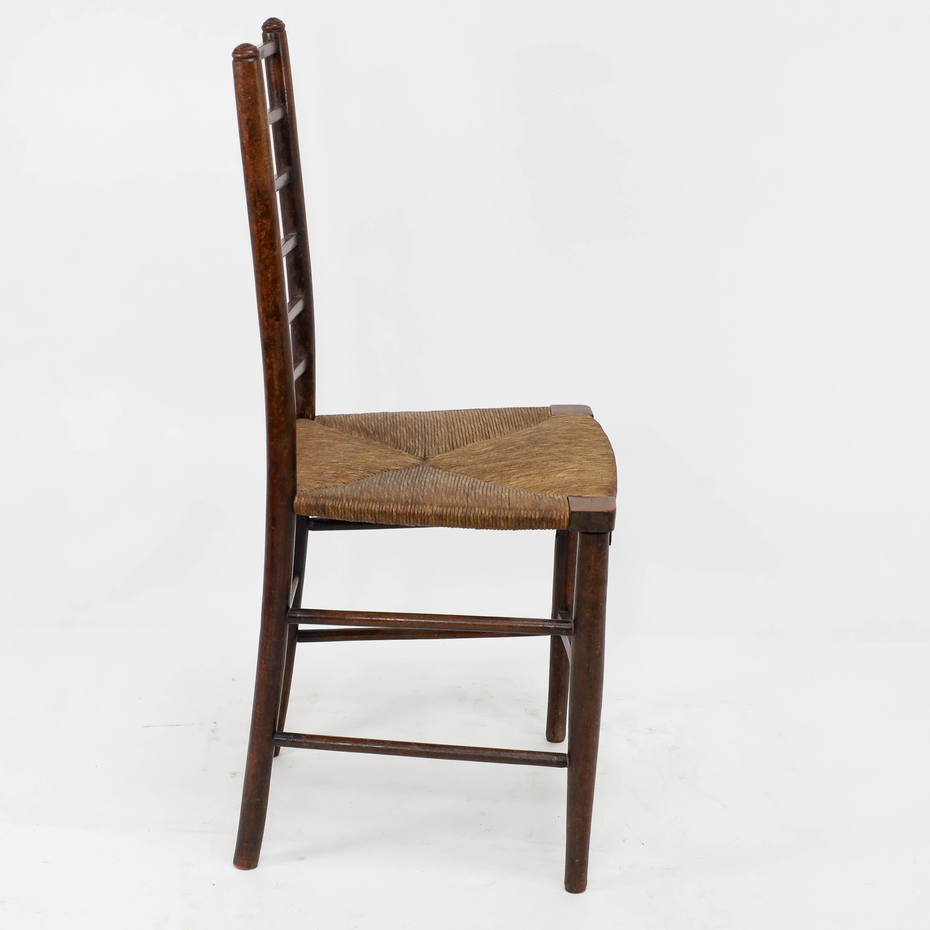 Hand-Crafted Liberty and Co, A pair of Arts and Crafts side chairs with finely rushed seats For Sale