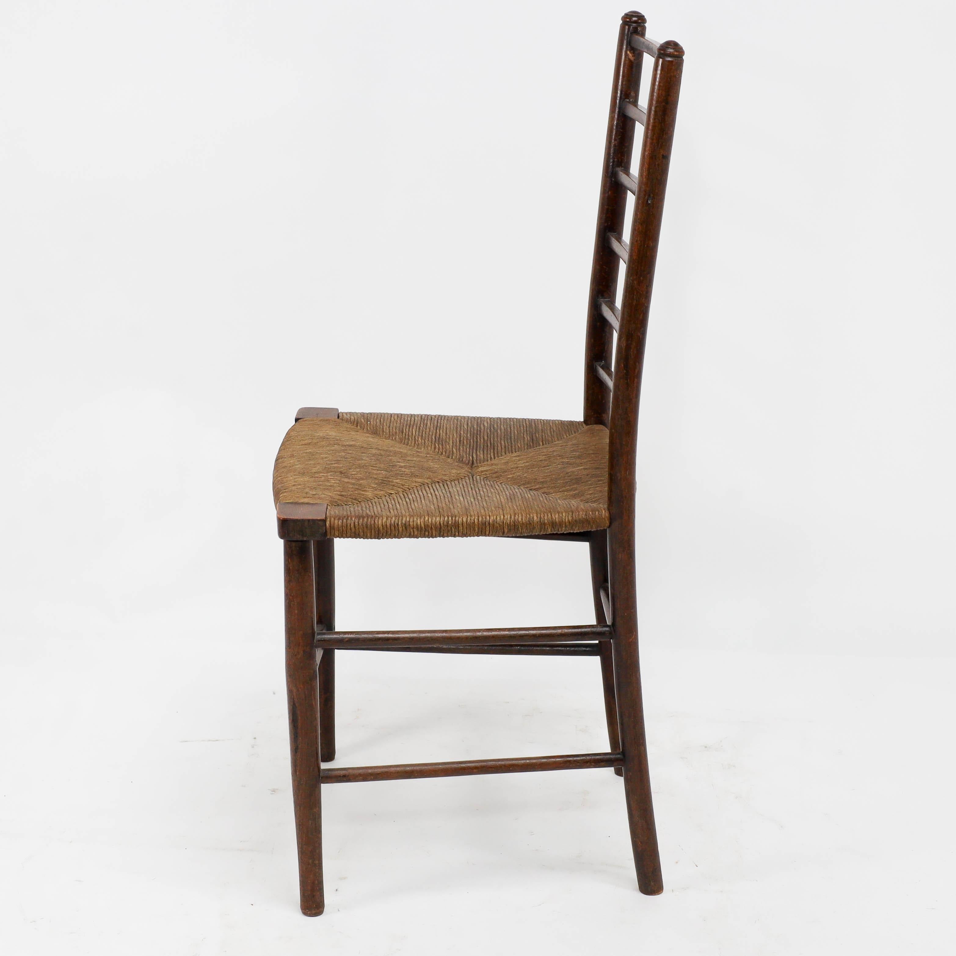 Liberty and Co, A pair of Arts and Crafts side chairs with finely rushed seats In Good Condition For Sale In London, GB