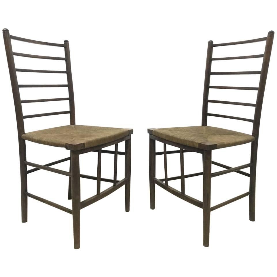 Liberty and Co, A Pair of Arts and Crafts Side Chairs with Finely Rushed Seats For Sale