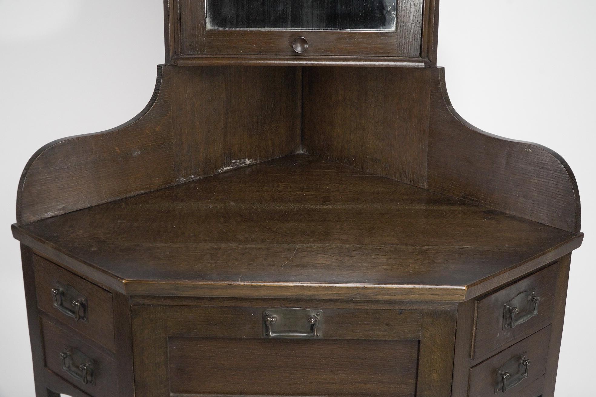 Oak Liberty and Co. A rare and unusual Arts and Crafts oak corner dressing table For Sale