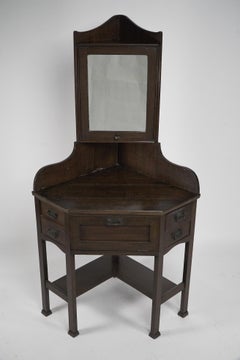 Liberty and Co. A rare and unusual Arts and Crafts oak corner dressing table