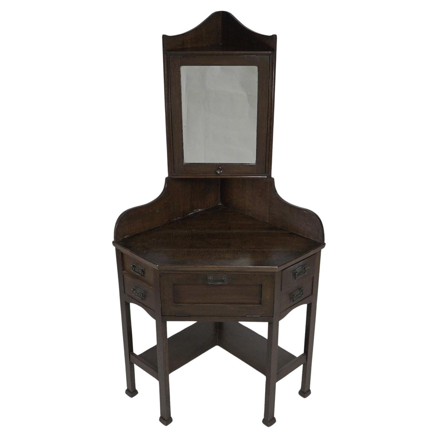 Liberty and Co. A rare and unusual Arts and Crafts oak corner dressing table For Sale
