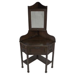 Liberty and Co. A rare and unusual Arts and Crafts oak corner dressing table