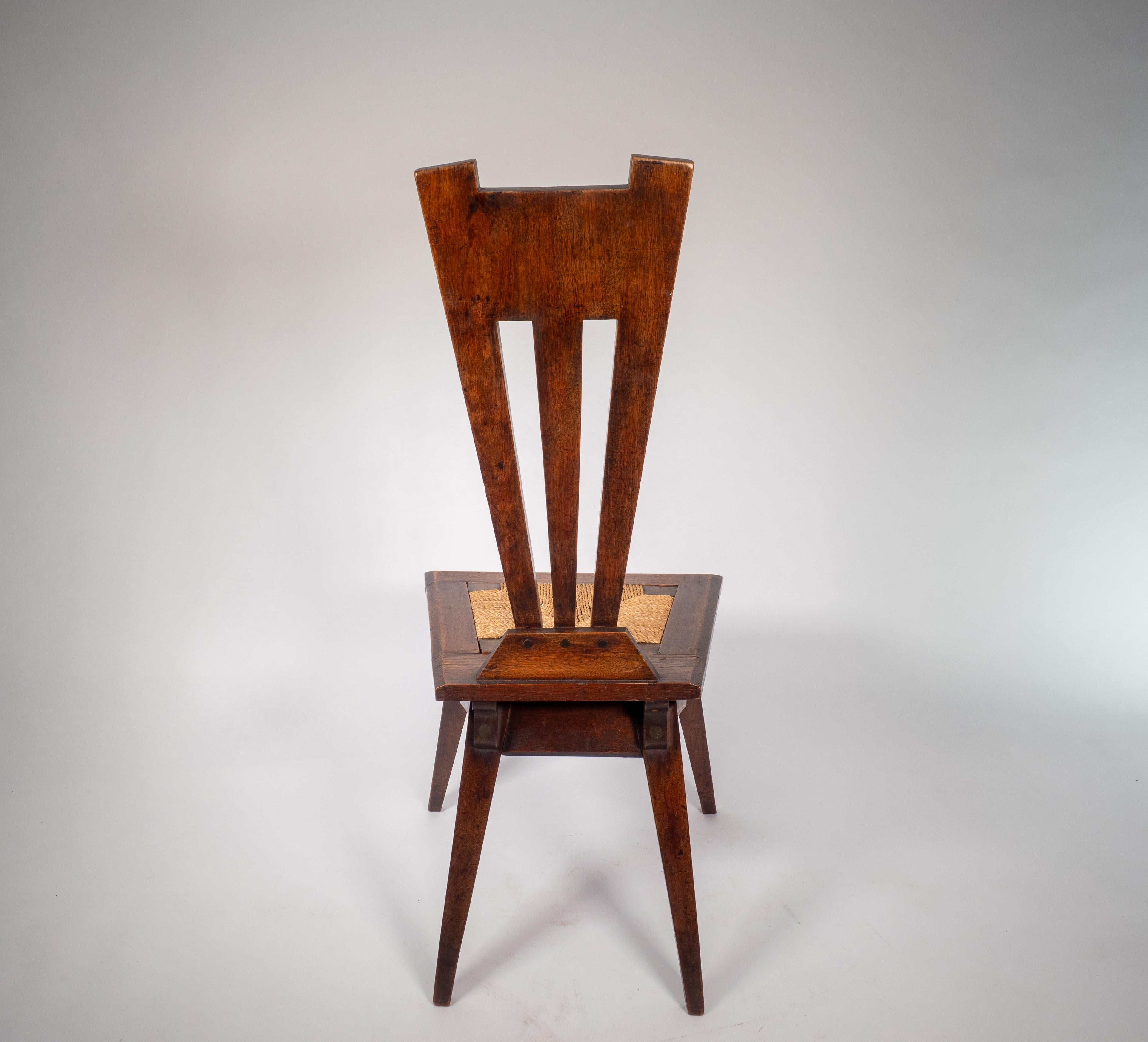 Late 19th Century Liberty and Co. An Arts and Crafts Wiclif rush seat side chair. For Sale