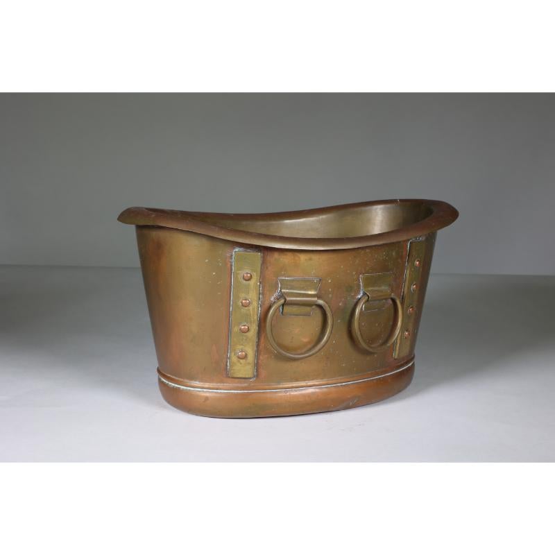 Early 20th Century Liberty and Co. A brass Arts and Crafts boat shaped champagne bucket. For Sale